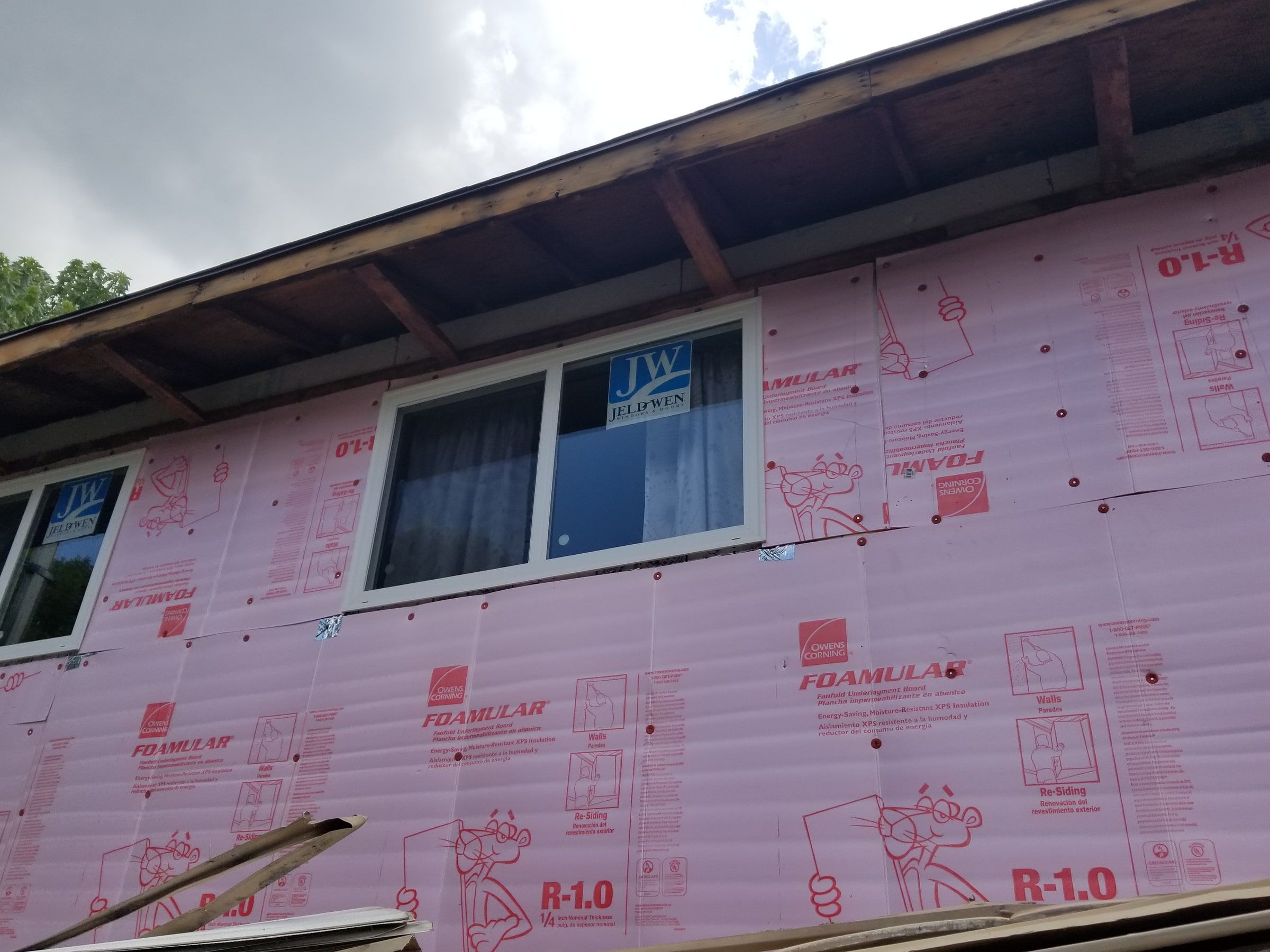 Fanfold insulation board across the upper wall under the open eave, Beavercreek, Ohio.