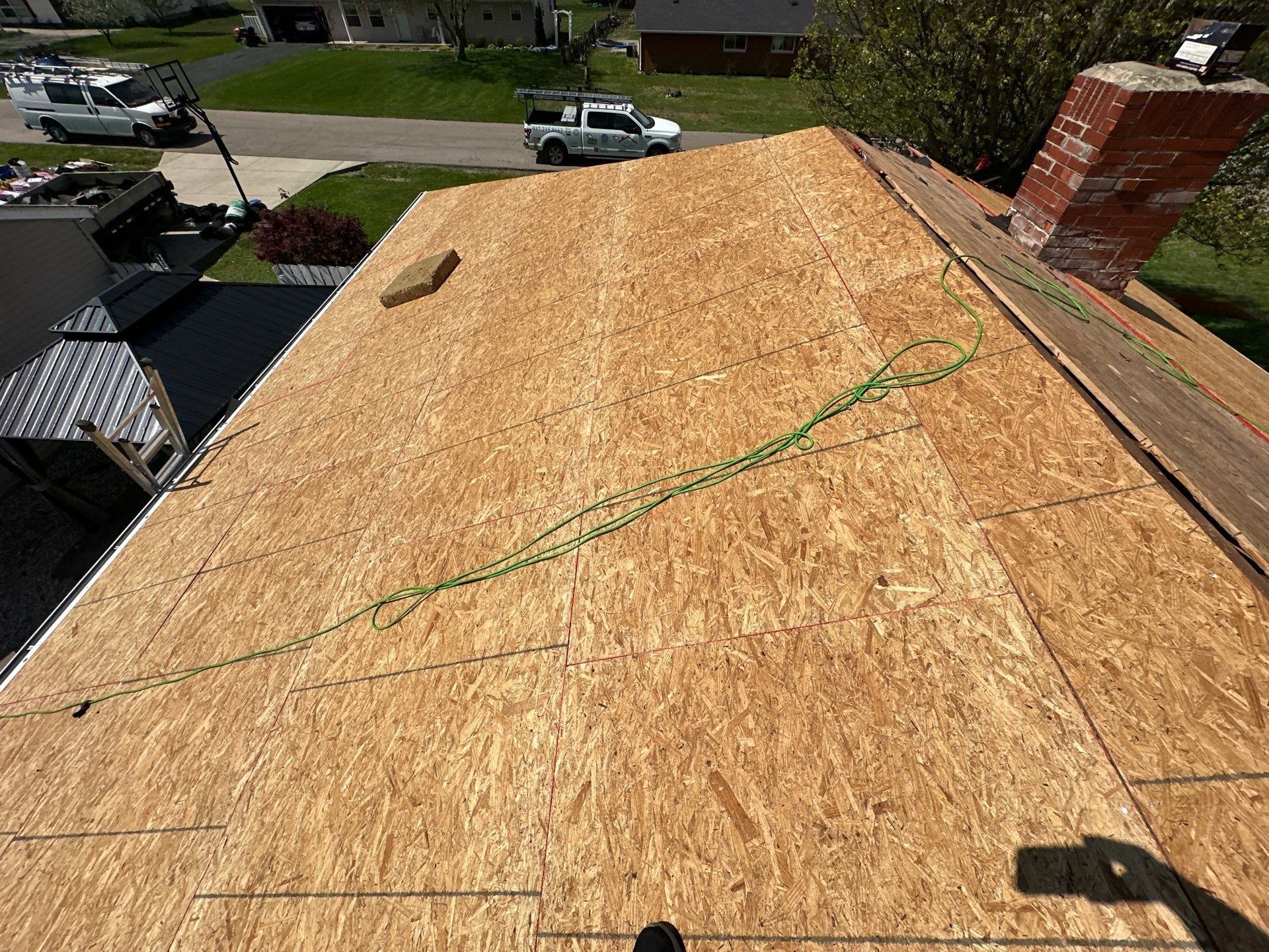 The roof covered in new OSB up to the chimney, Beavercreek, Ohio.