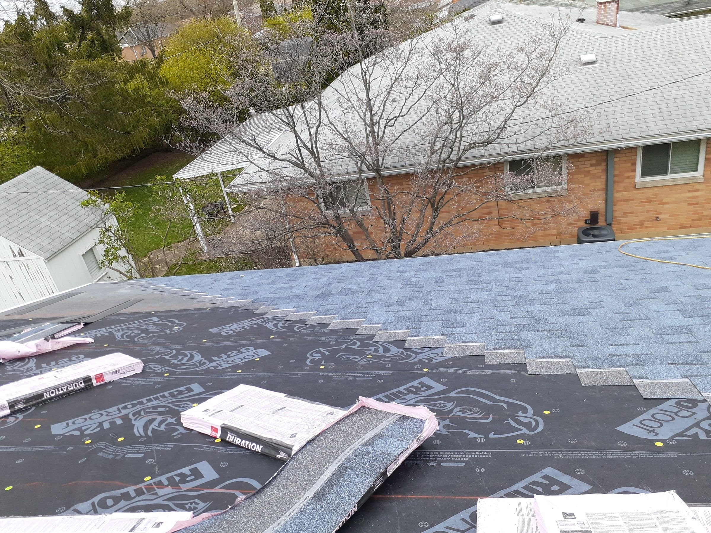 New shingle courses meeting the underlayment on the back slope, Kettering, Ohio.