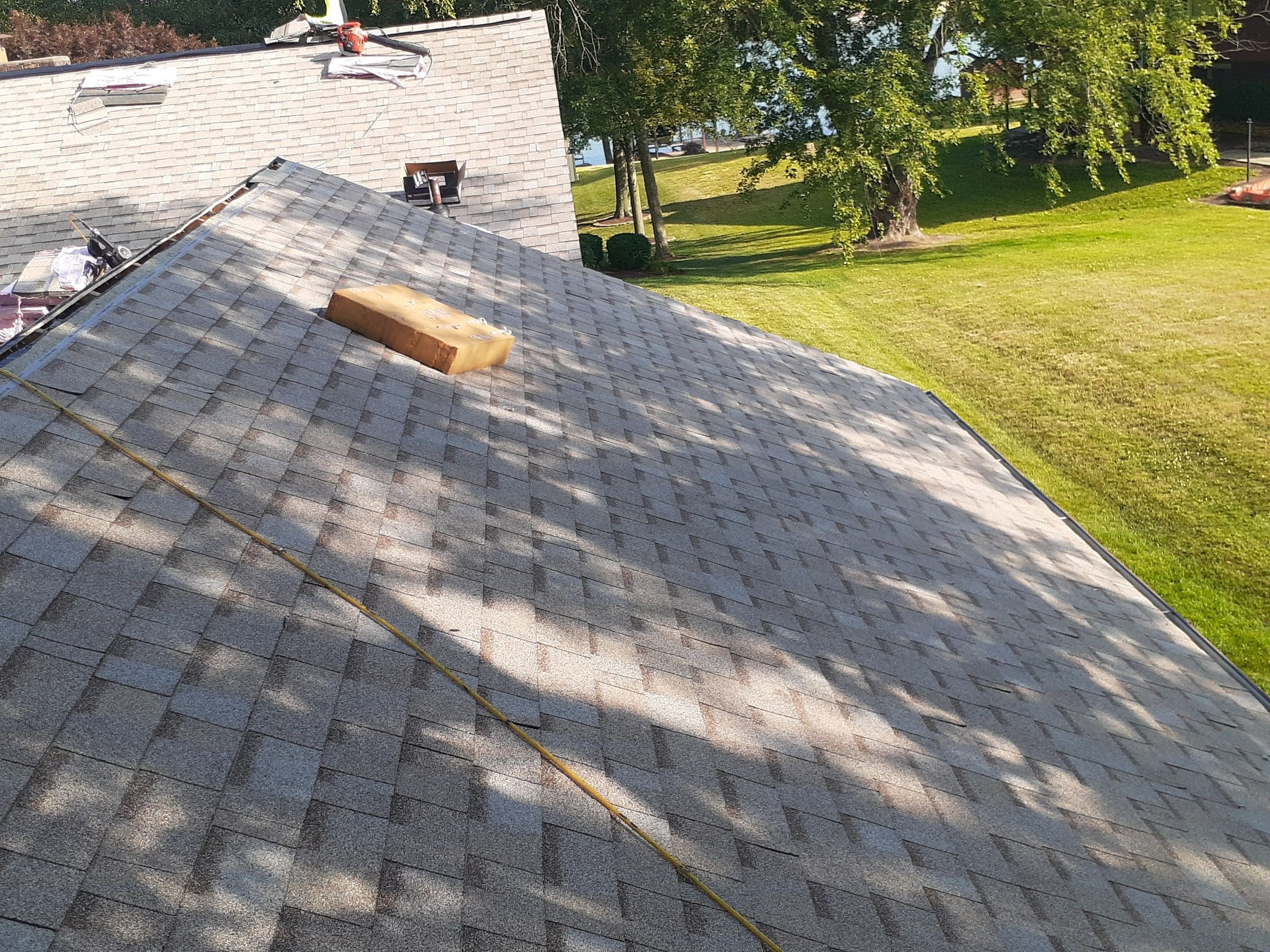 Chalk line snapped across the shingles to keep the rows straight, Jamestown, Ohio.