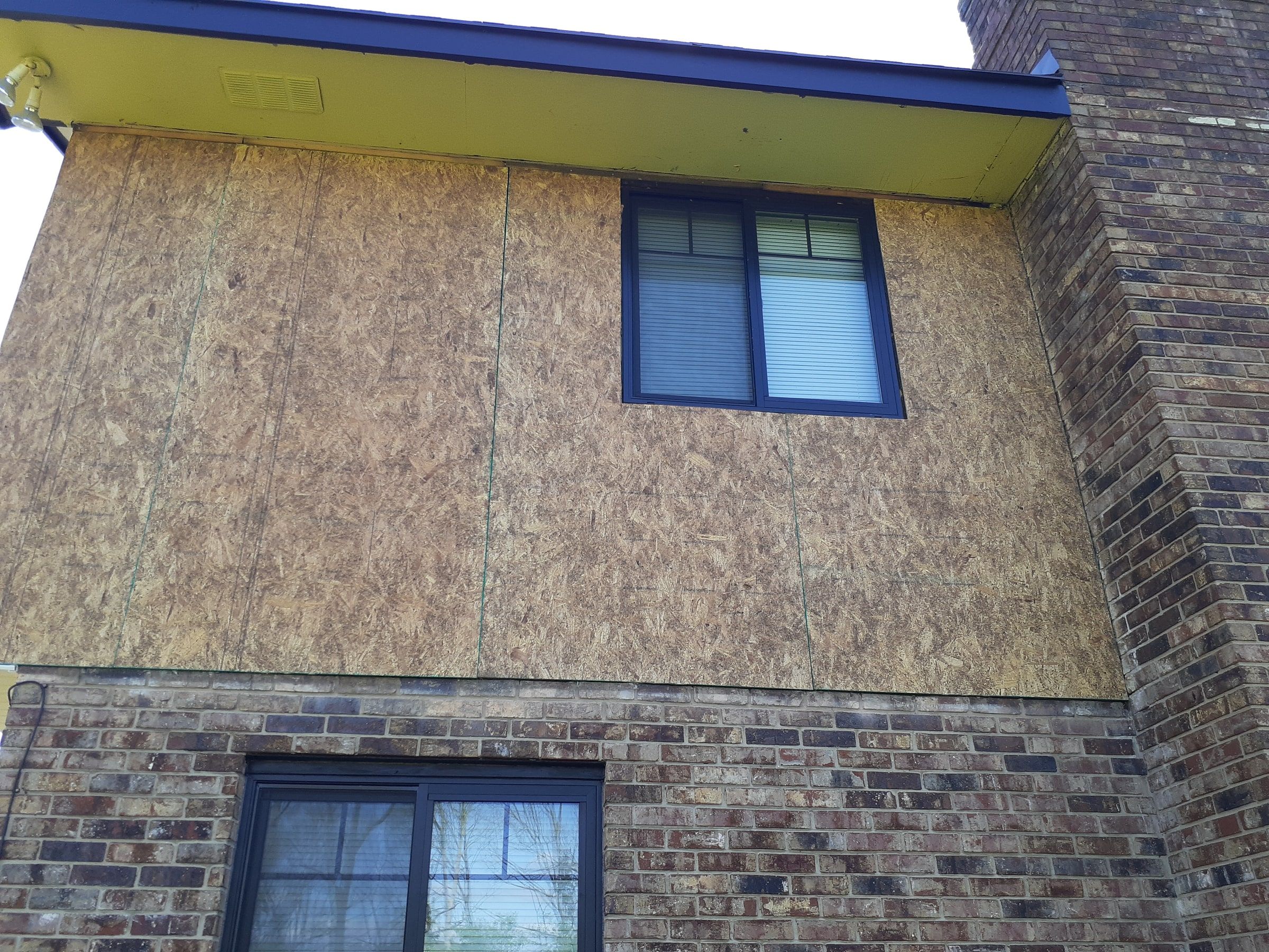 The sheathed back wall above the brick, under the soffit, Beavercreek, Ohio.