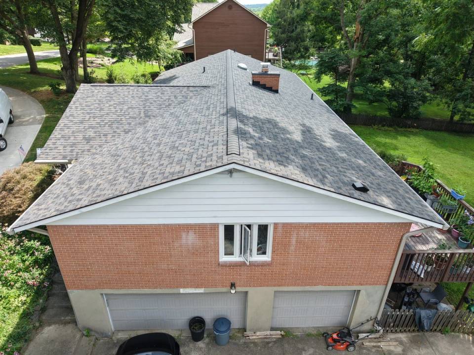 Drone photo of the finished roof over a brick house on Stauffer Dr, Beavercreek, Ohio.