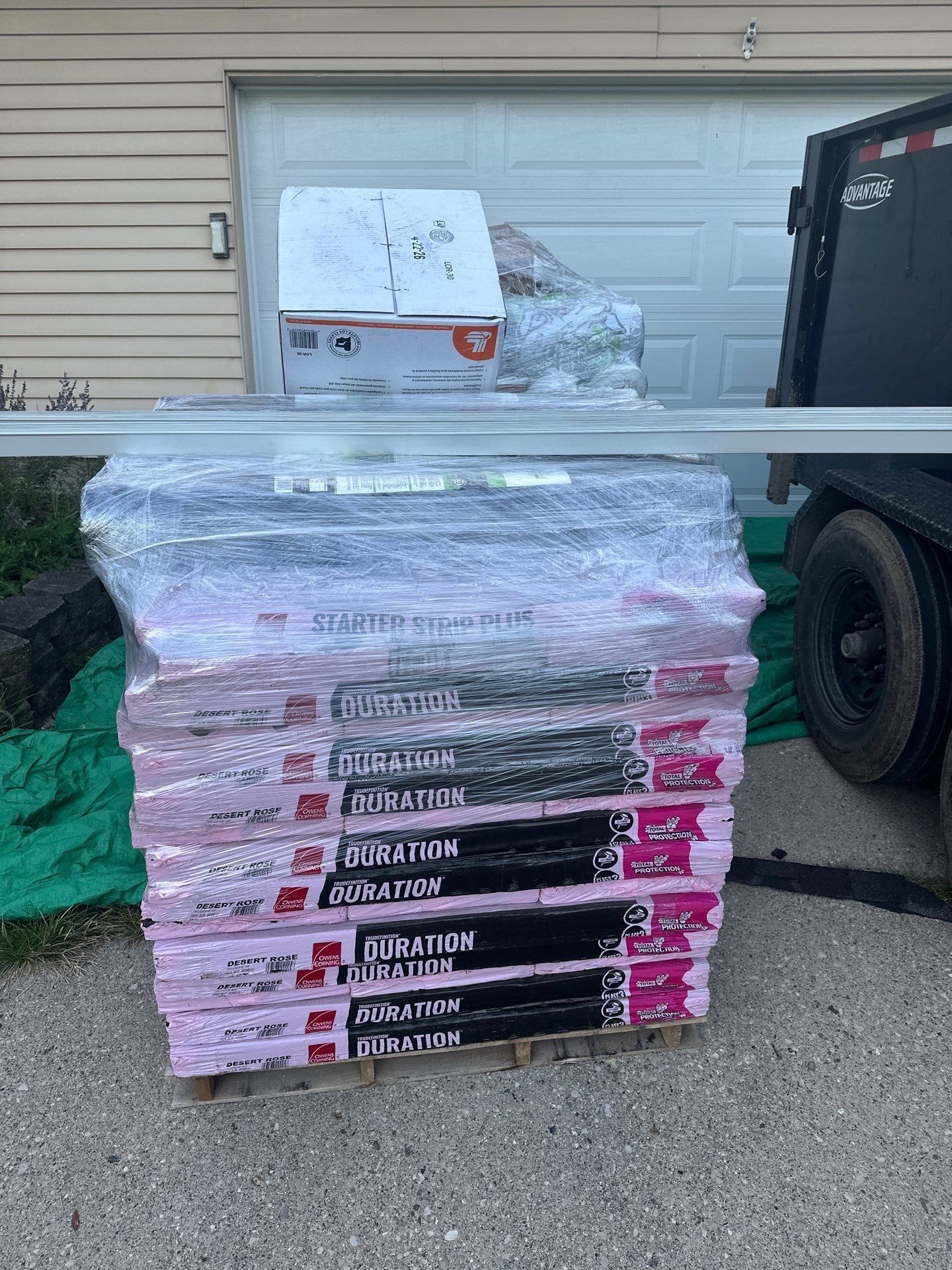 A pallet of Owens Corning Duration shingles and starter strip on the driveway, Fairborn, Ohio.