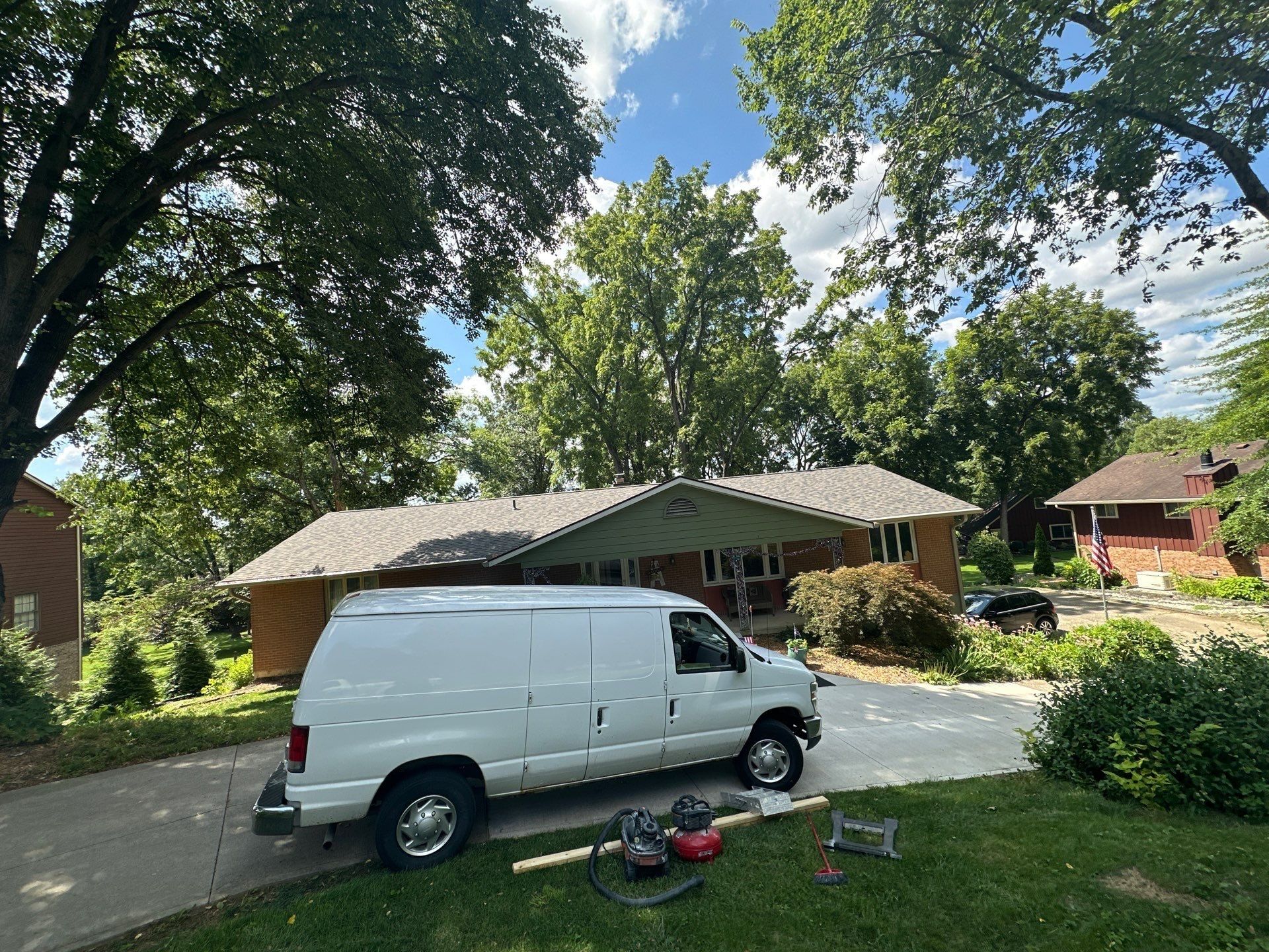 House from the lawn and work van