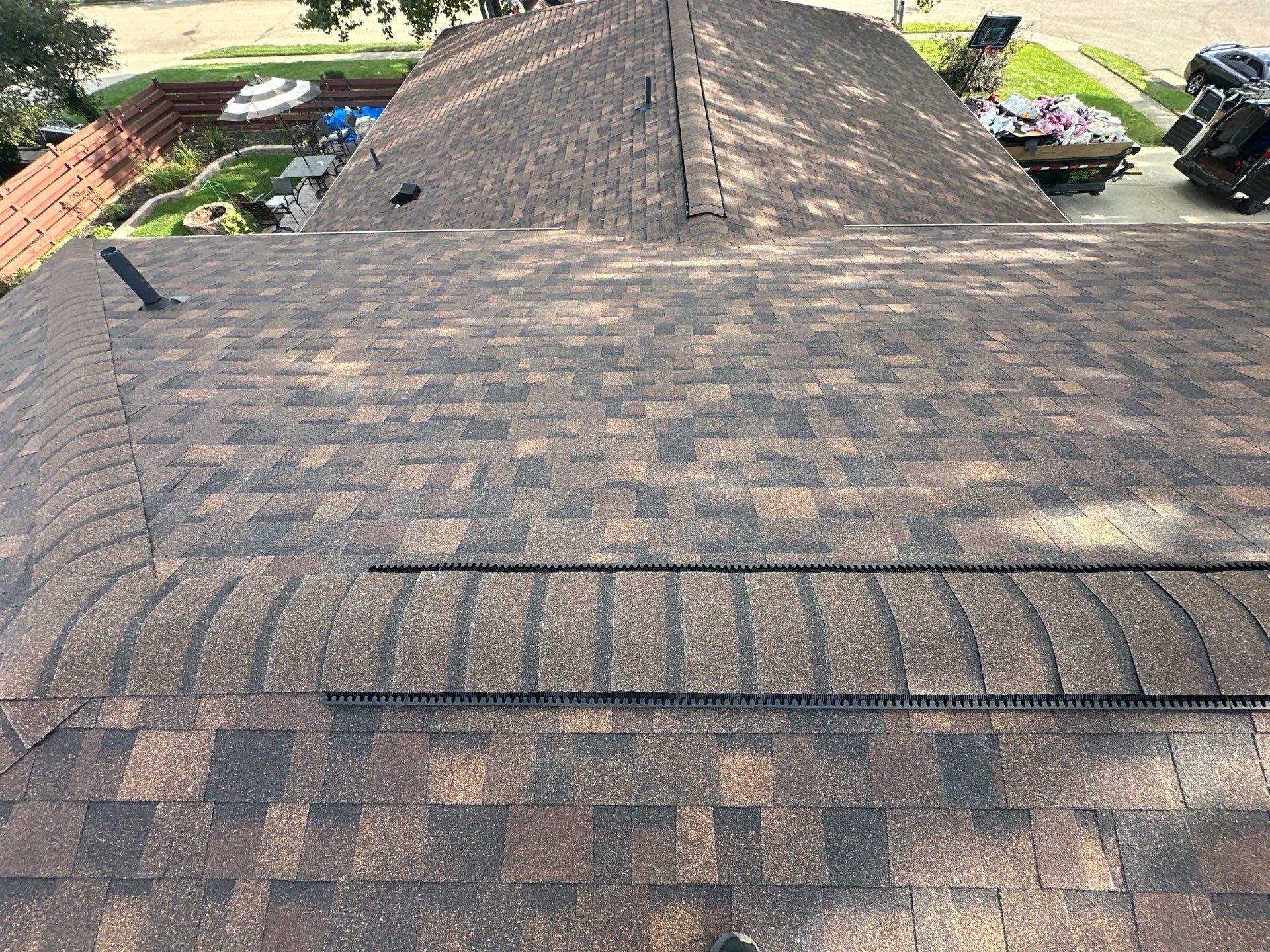 Finished ridge vent along the lower roof, with the upper roof behind it, Dayton, Ohio.
