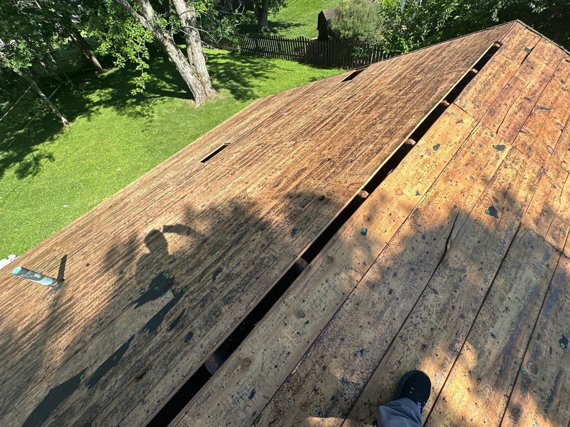 The bare board deck along the eave after the shingles came off, Beavercreek, Ohio.