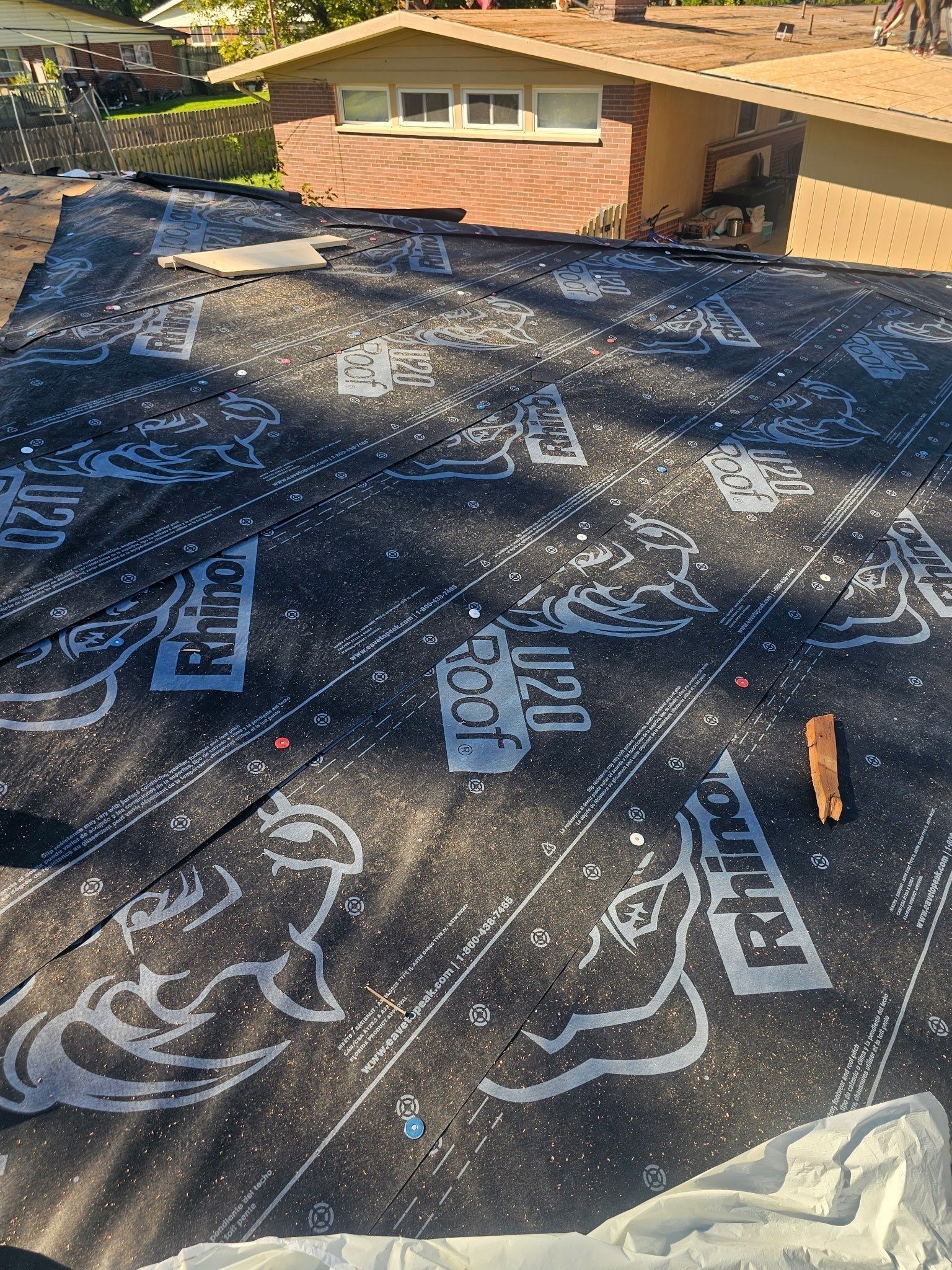 RhinoRoof U20 synthetic underlayment nailed over the repaired deck, Kettering, Ohio.