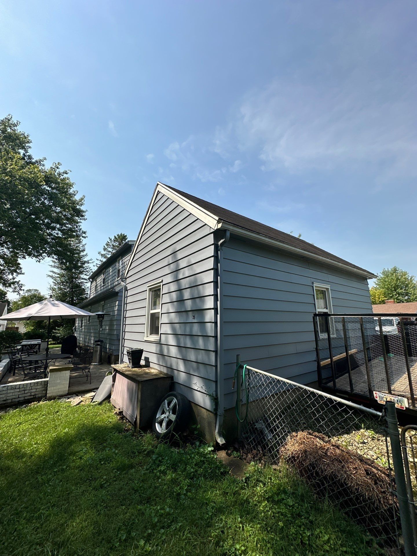 The side of the attached garage beside the patio fence, Beavercreek, Ohio.