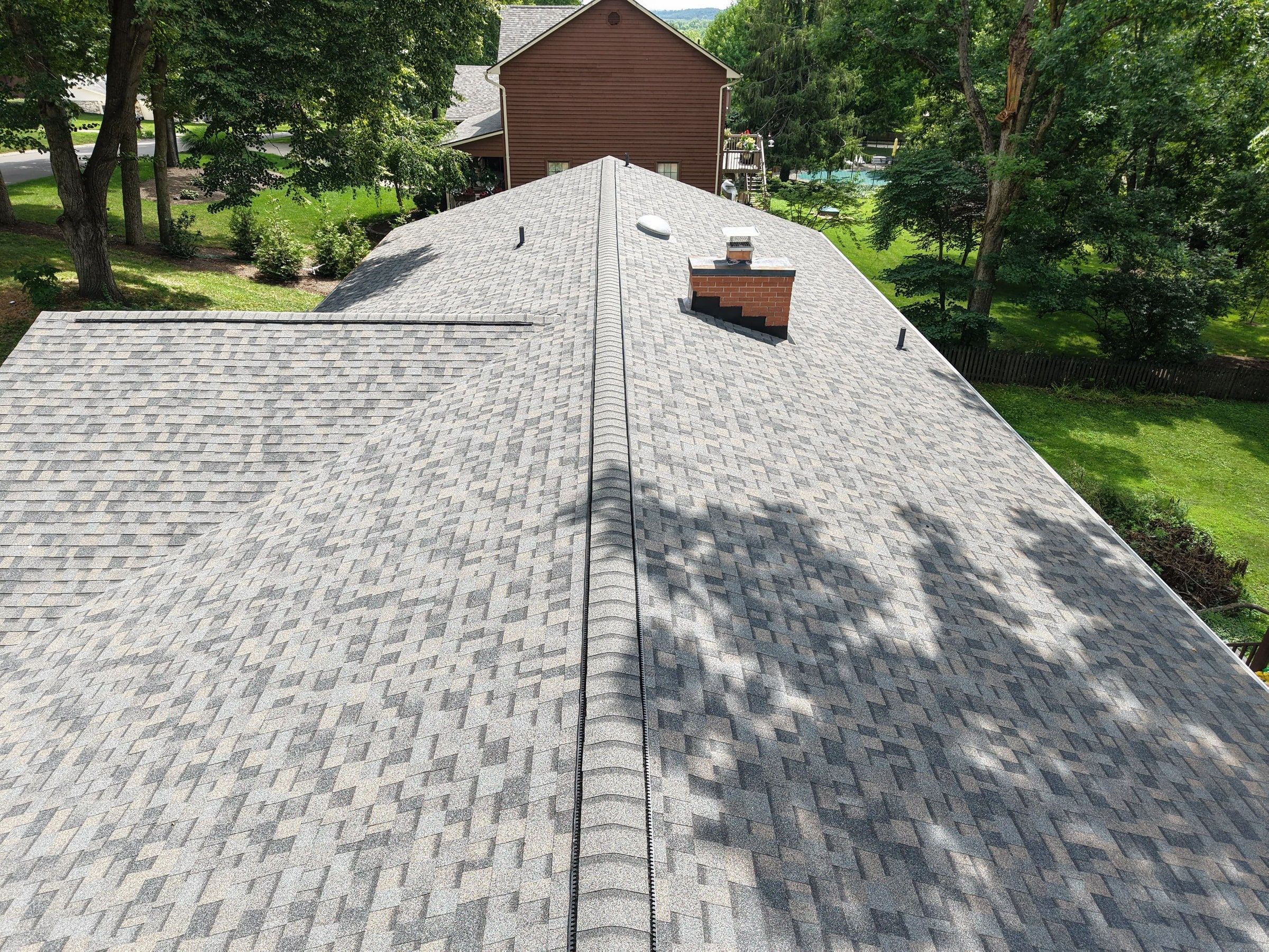 Ridge past the chimney, red house beyond