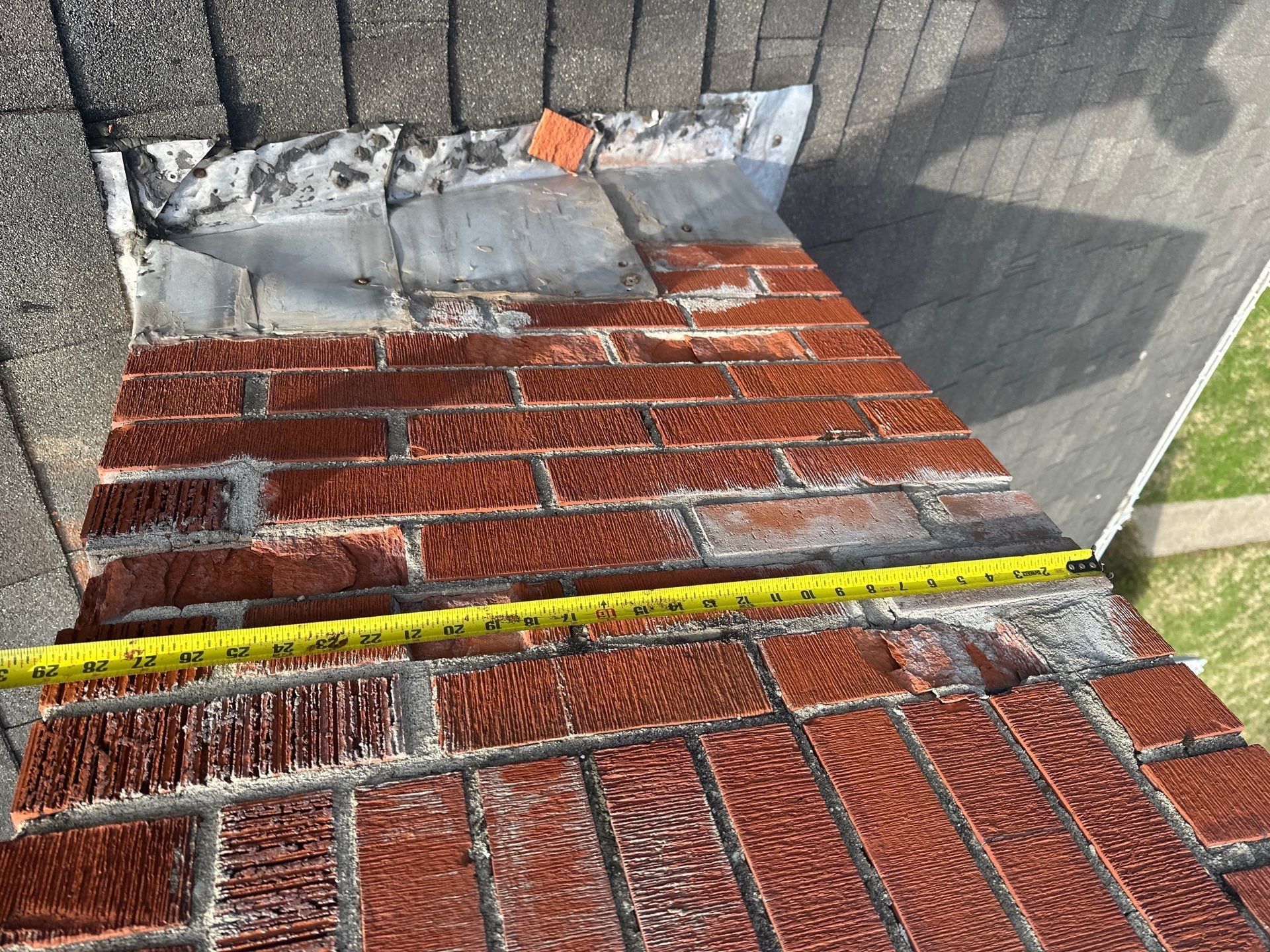 Tape along the chimney base