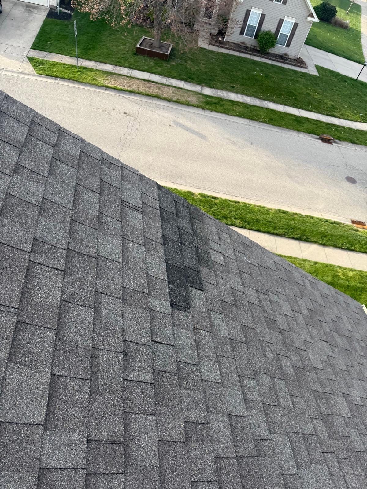 New shingles in the weathered roof