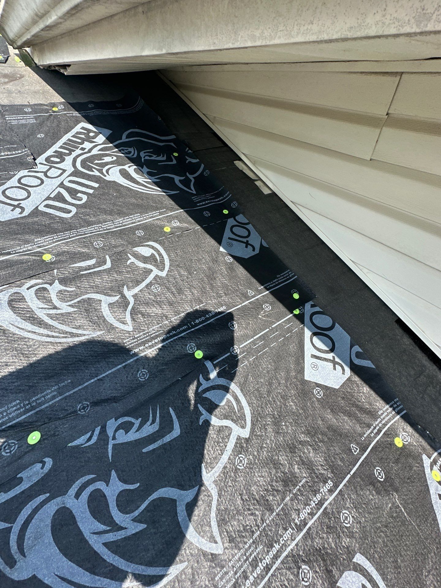 Ice and water shield running up the sidewall where the roof meets the house, Dayton, Ohio.