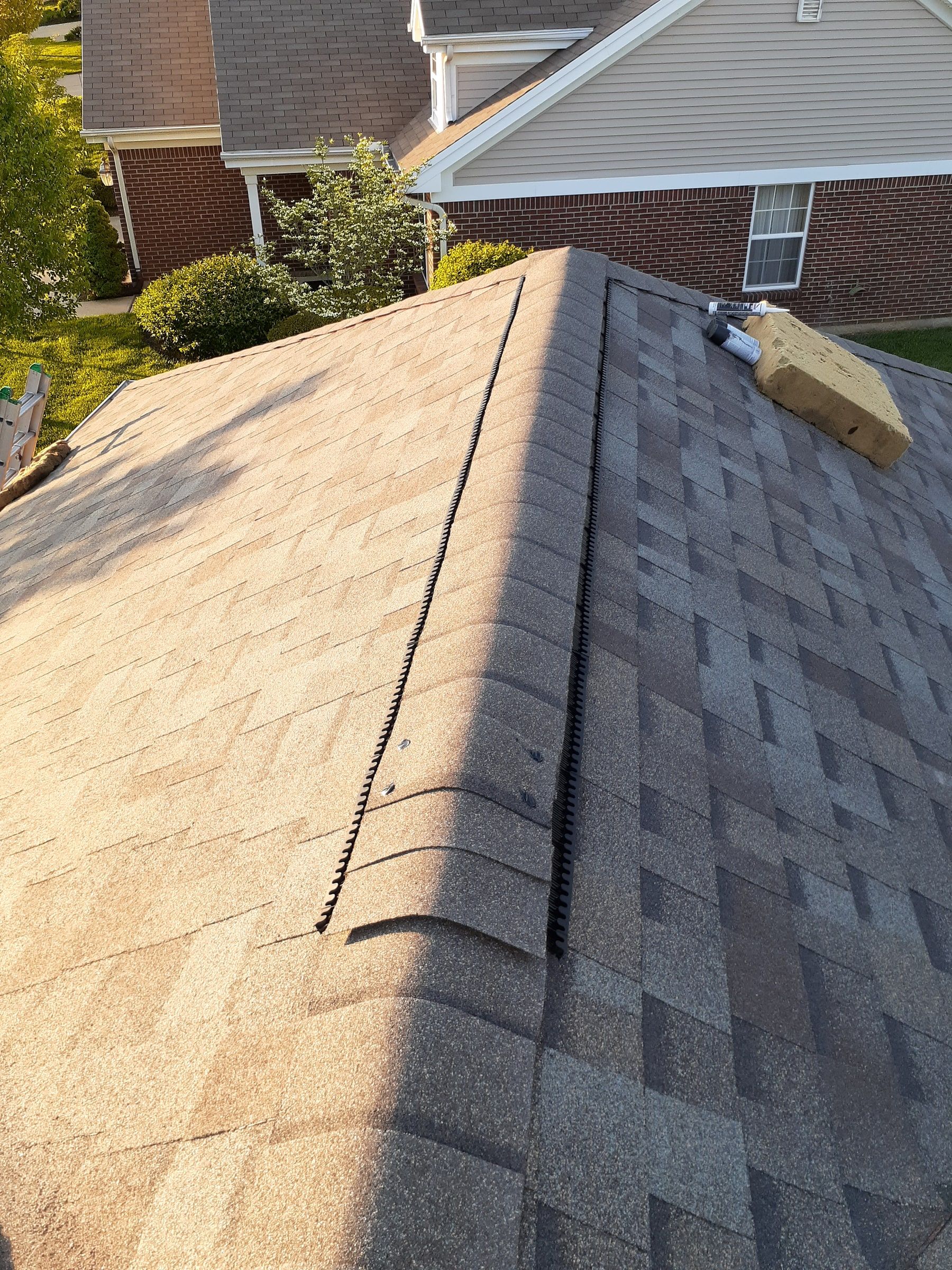 A finished ridge above the neighbor's house in the evening, Xenia, Ohio.