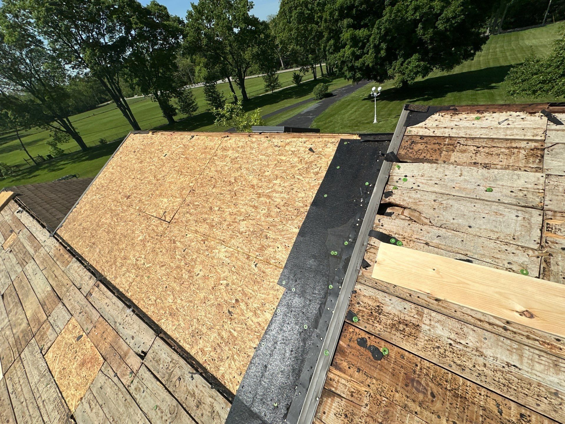 Re-decked plane beside original boards