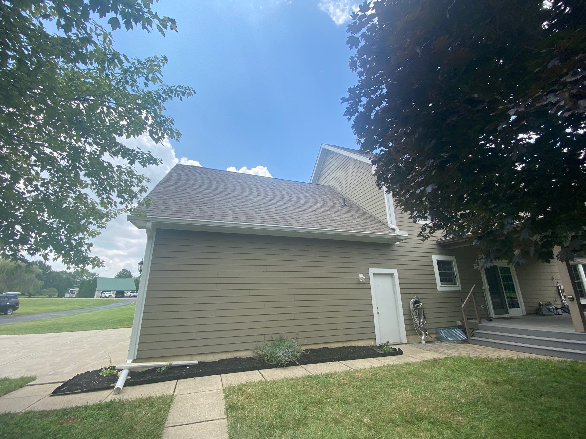 Side of the house showing the finished garage wing roof, Yellow Springs, Ohio.