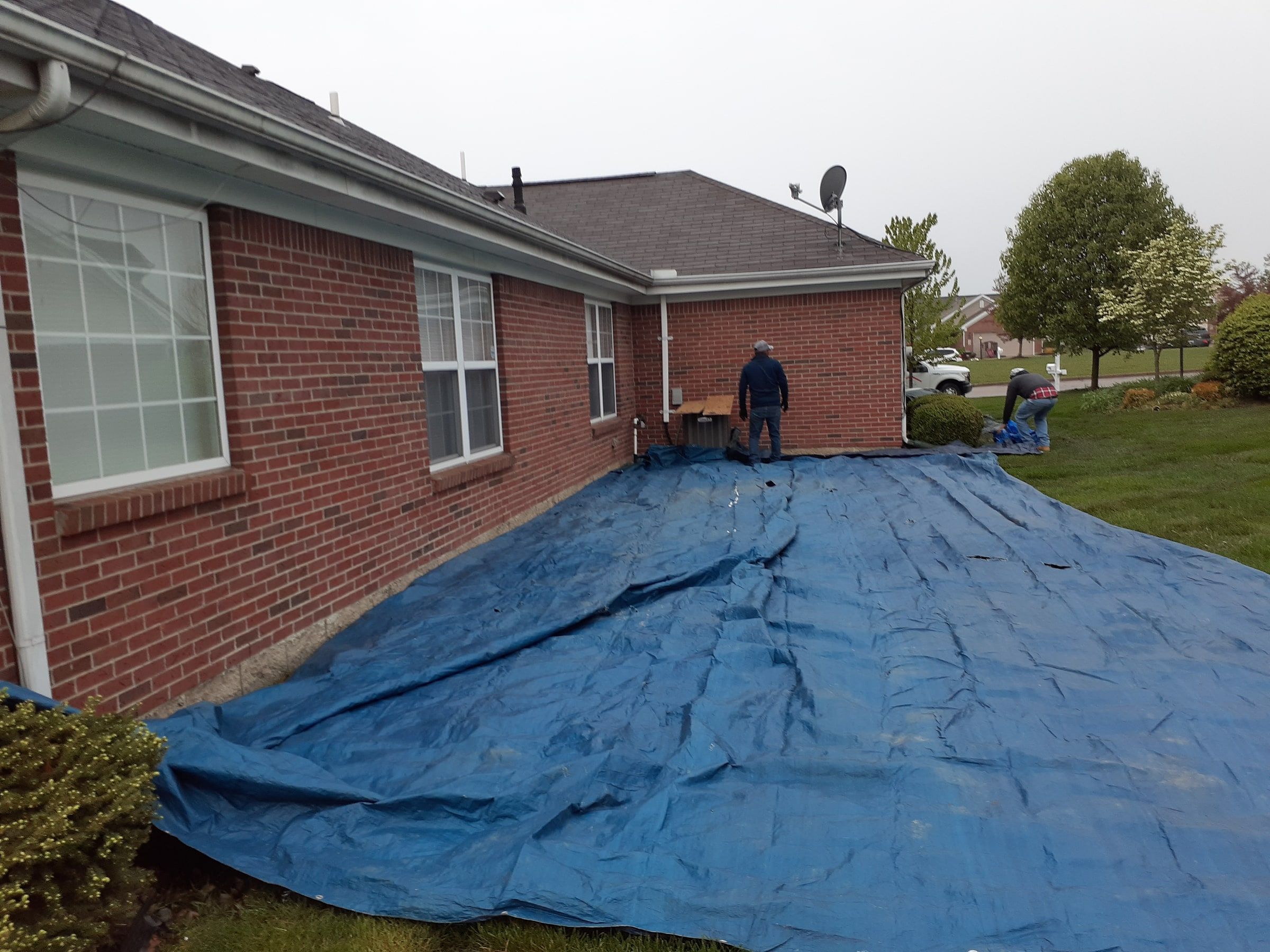 Two workers, side elevation and tarps