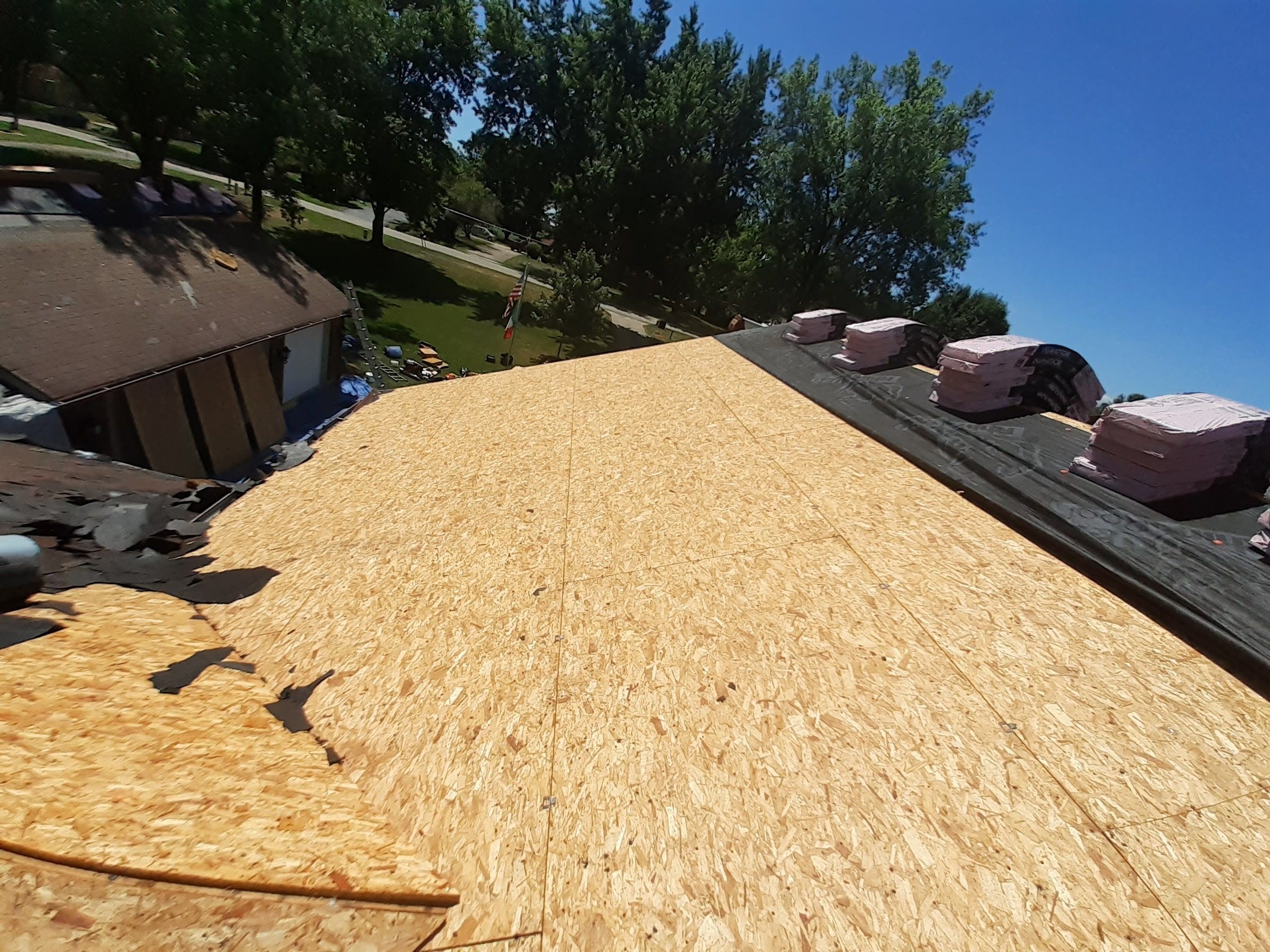 Wide view of the stripped deck with bundles waiting at the ridge, Jamestown, Ohio.