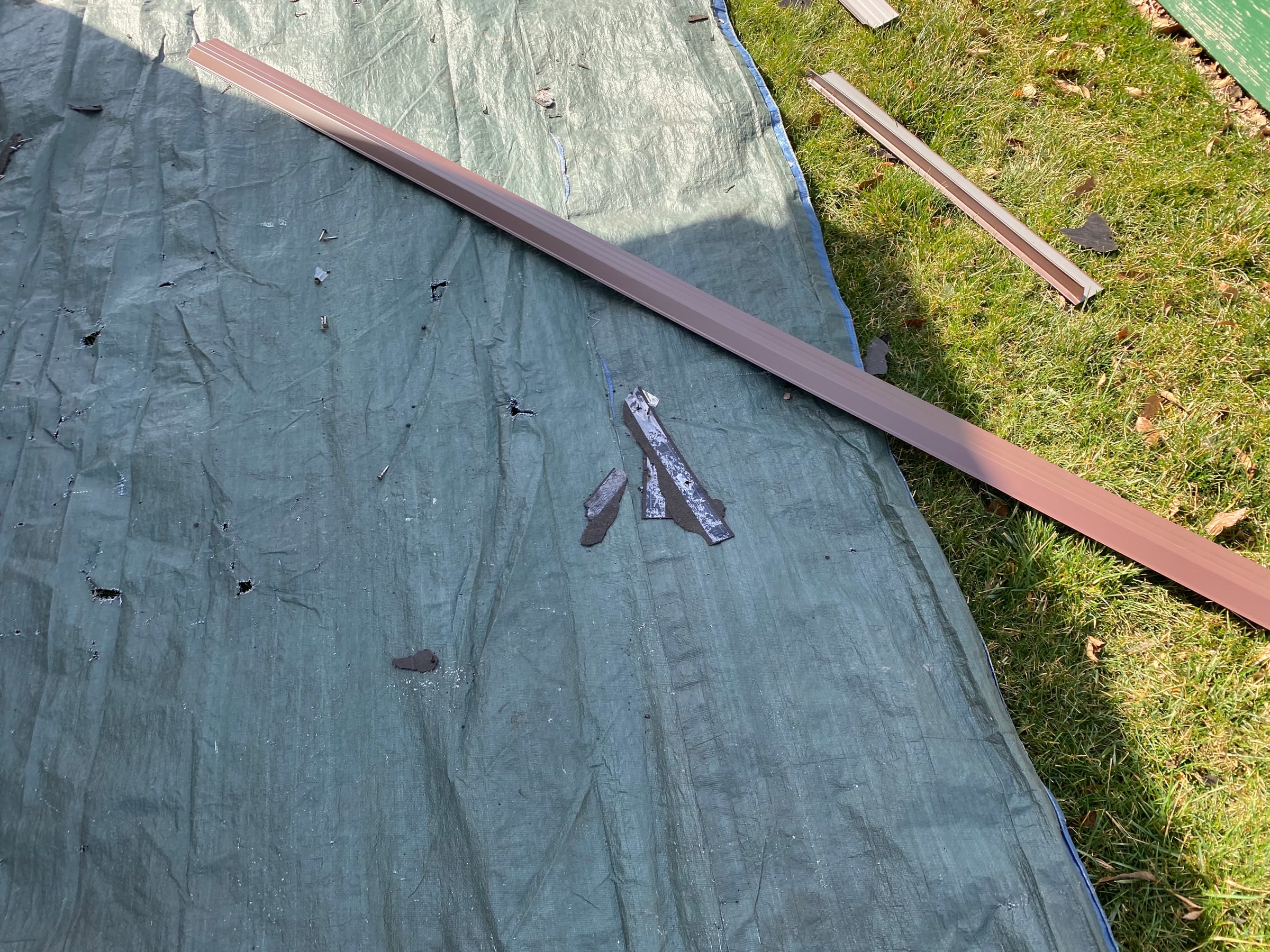 Shingle debris and brown edge metal lengths