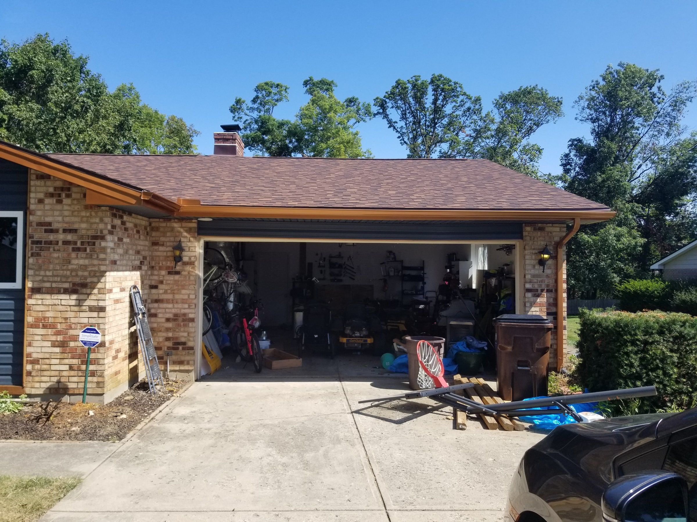 The garage with new copper-colored gutters and trim, Beavercreek, Ohio.