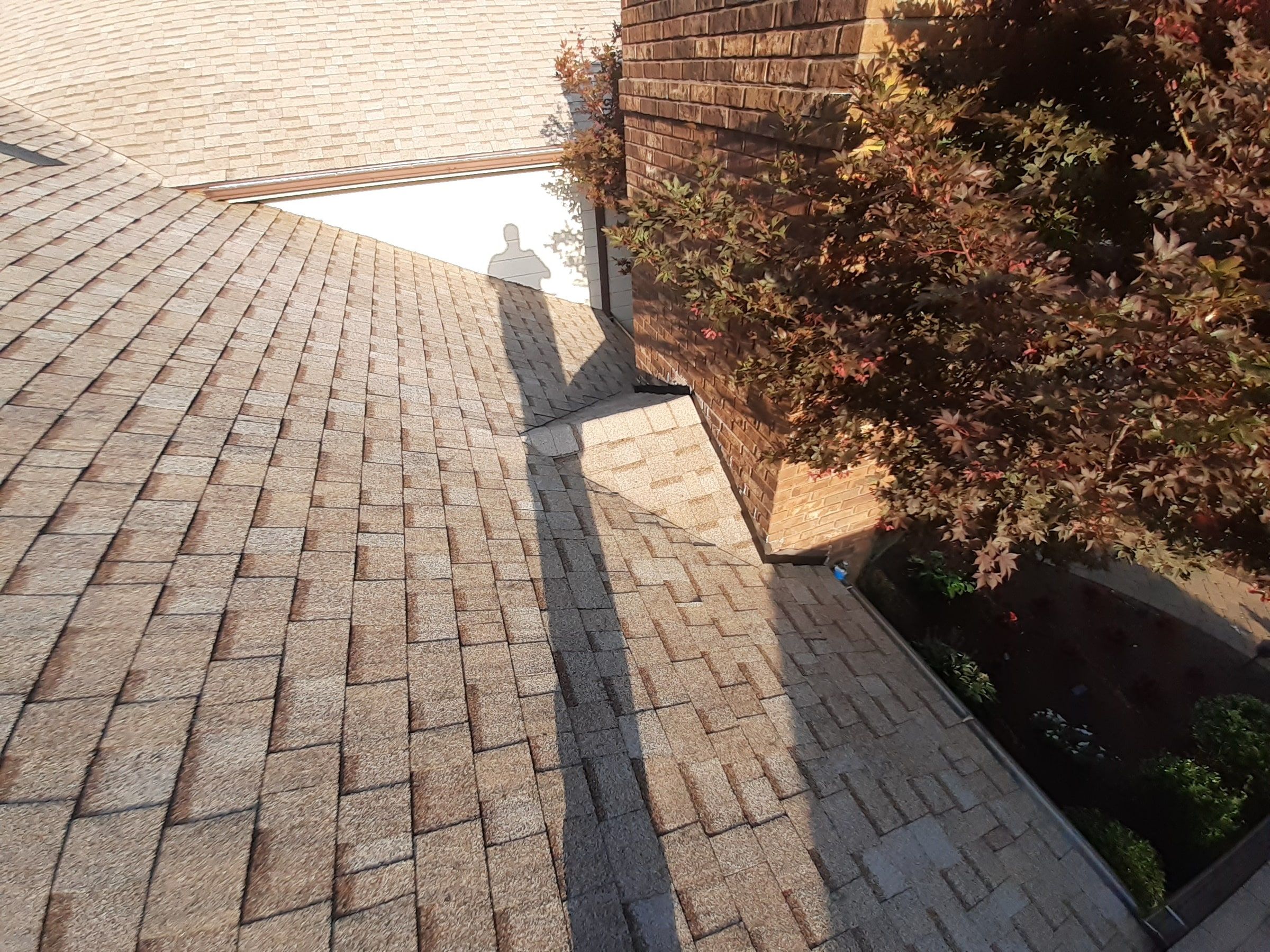 New shingles running down the valley toward the chimney, Jamestown, Ohio.