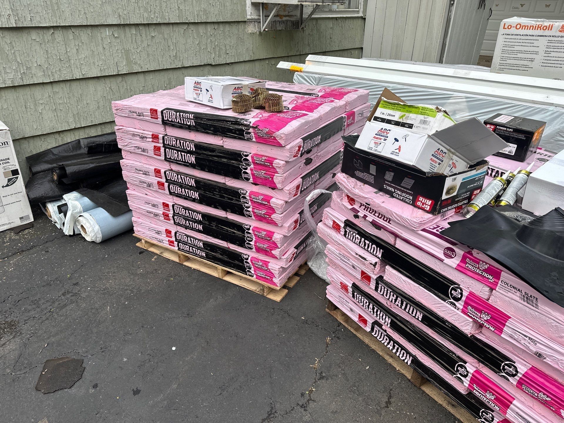 Pallets of Owens Corning Duration shingles delivered to the driveway, Dayton, Ohio.