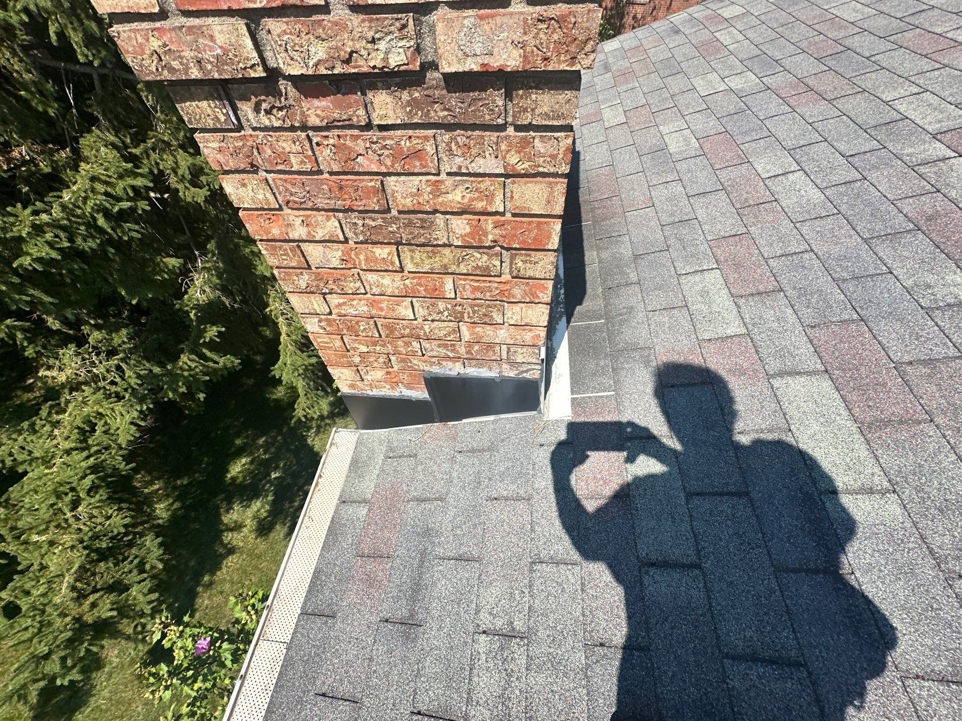 The side of the chimney where the old flashing meets the shingles, West Carrollton, Ohio.