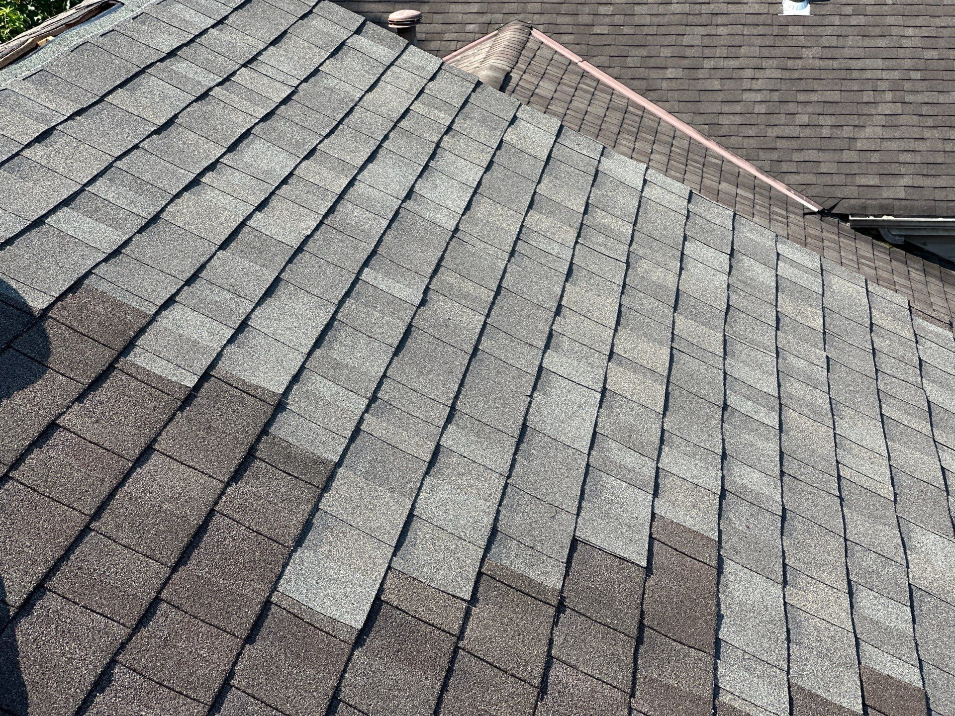 Shingles up to the uncapped lower peak