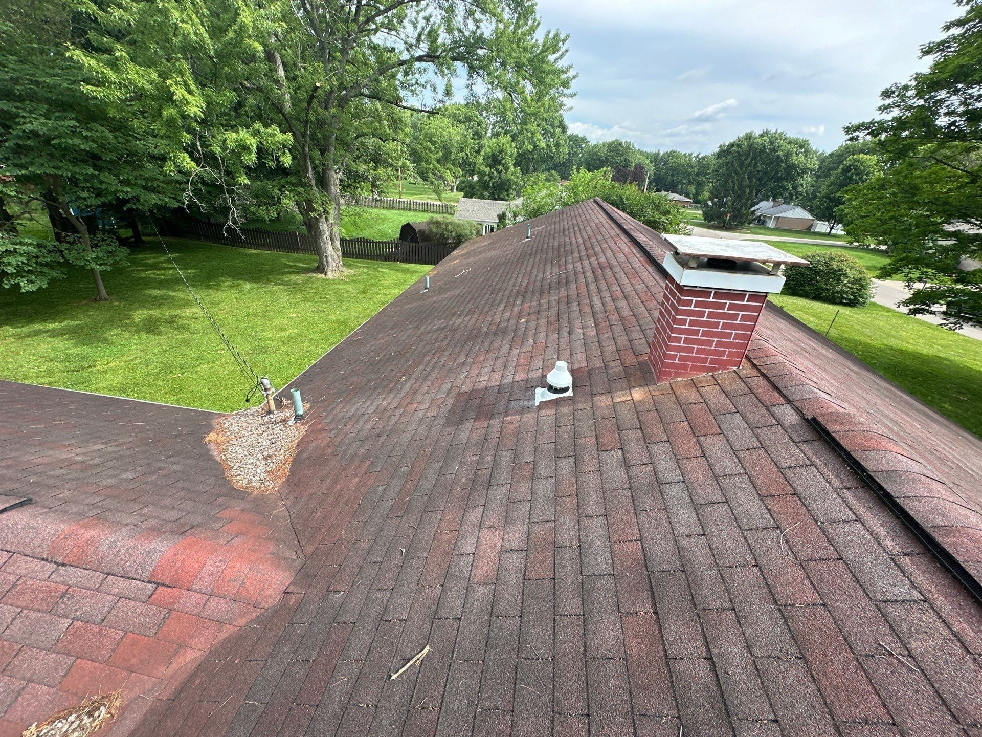 Red-brown roof and a bare patch