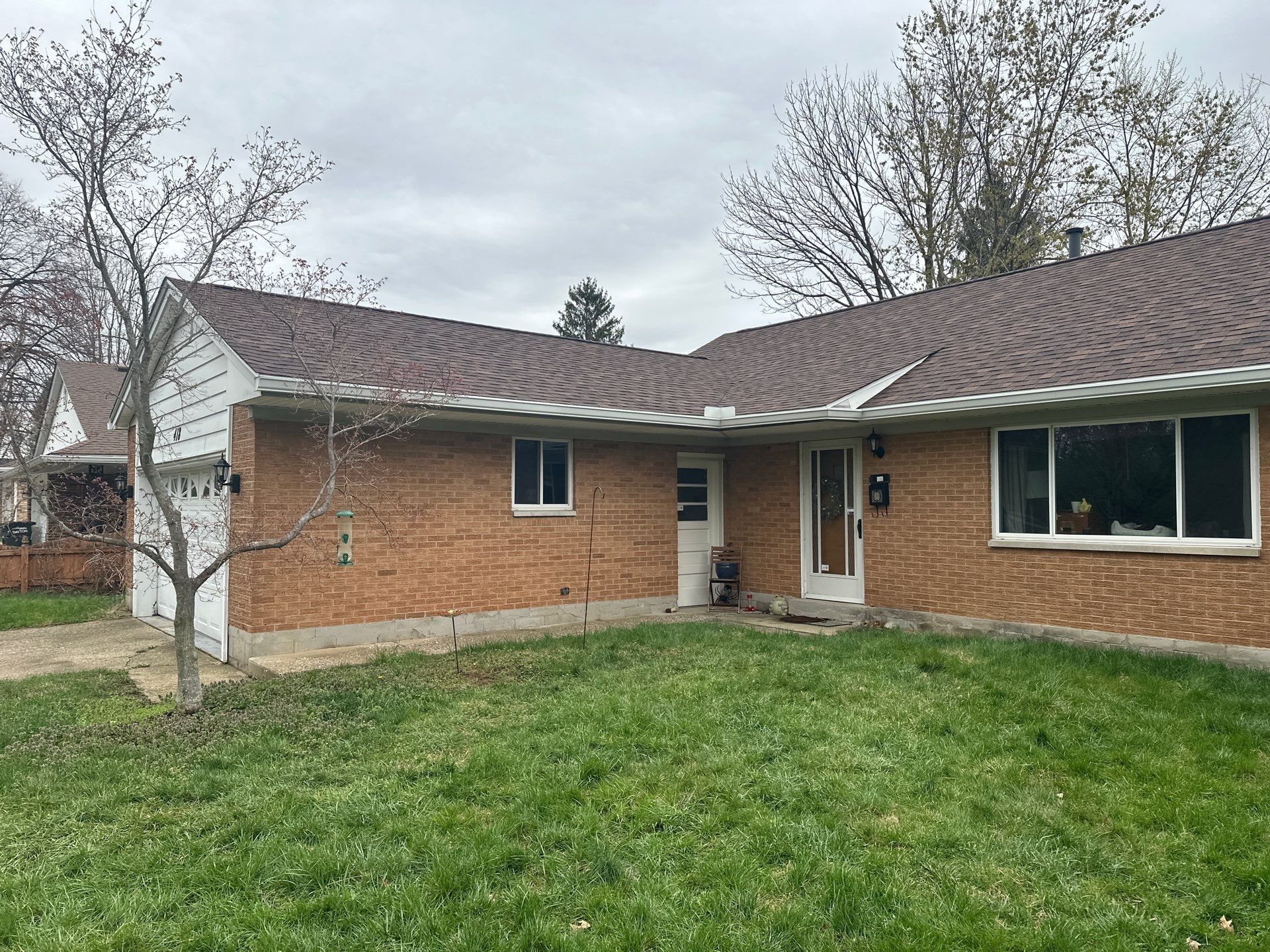 The finished roof on the brick ranch house, seen from the front lawn, Dayton, Ohio.