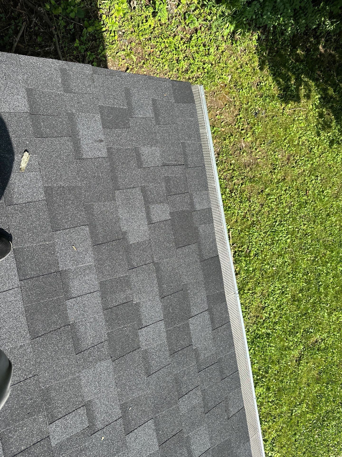 Shingles out to the white edge metal