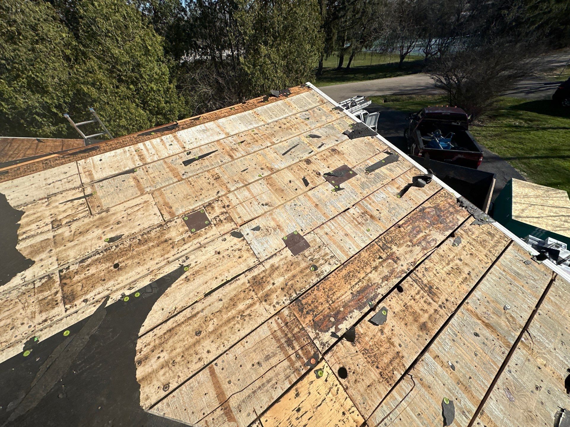 Old felt and the plank decking beneath