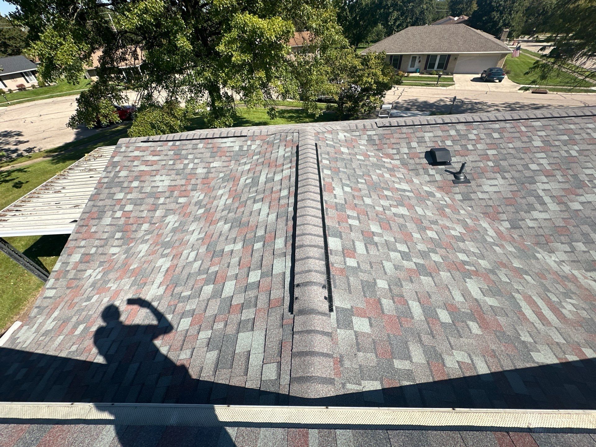 Ridge vent on the finished lower roof, above the covered patio, West Carrollton, Ohio.