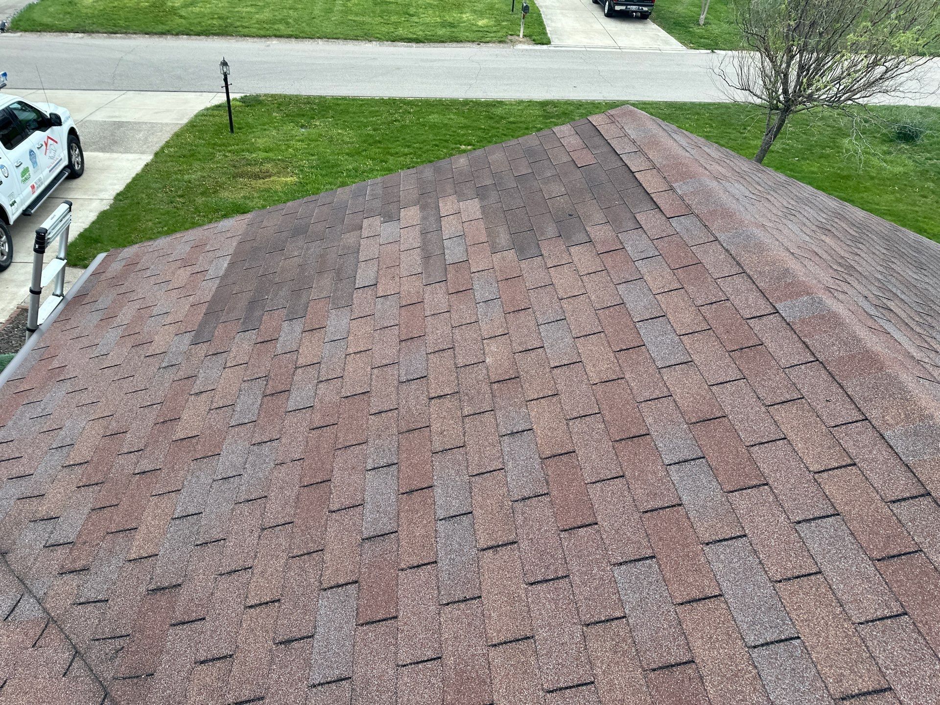 A patch of darker shingles near the hip of the old roof, Beavercreek, Ohio.