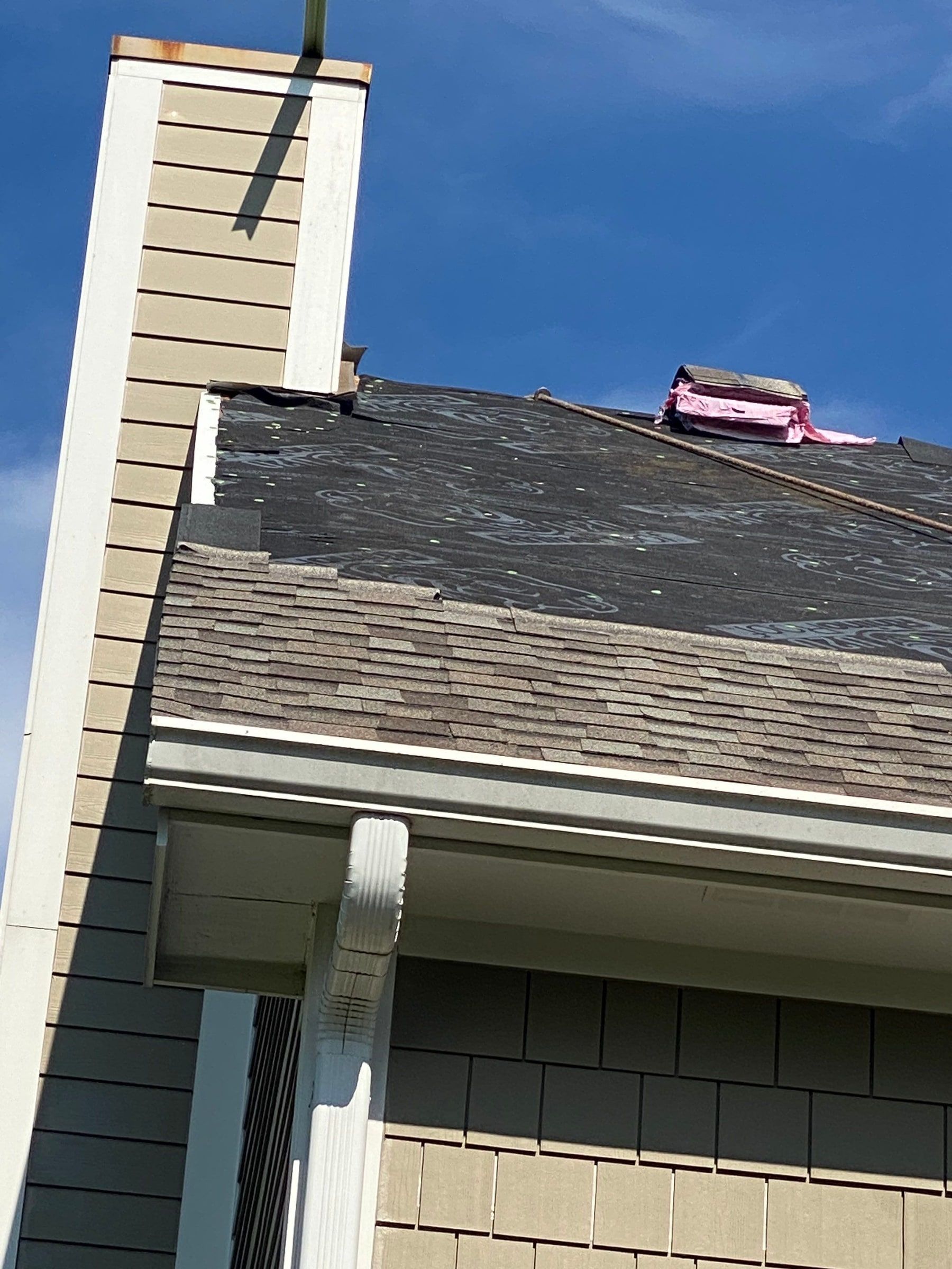 New shingles starting up the slope beside the chimney chase, Yellow Springs, Ohio.