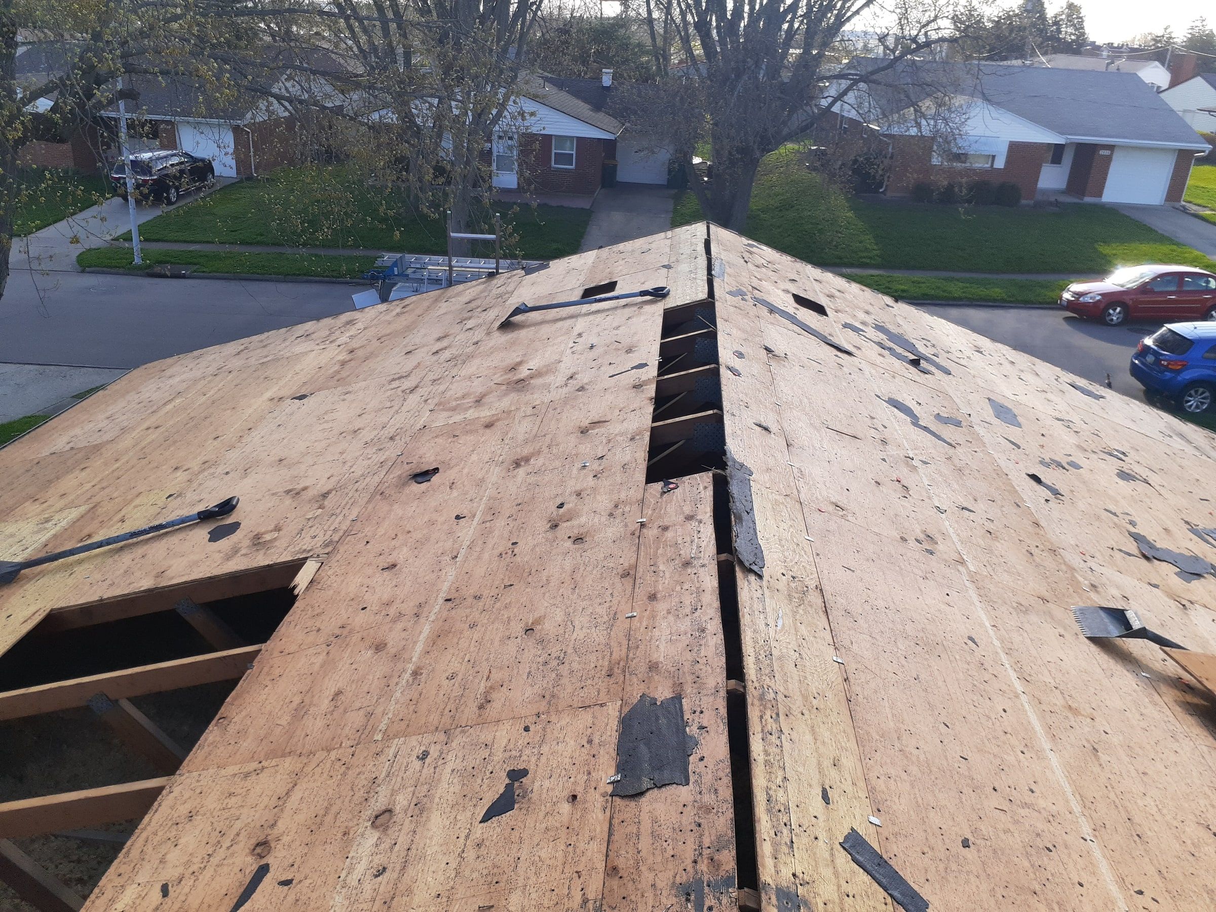 The old plank deck after tear-off, with sections cut out near the ridge, Kettering, Ohio.