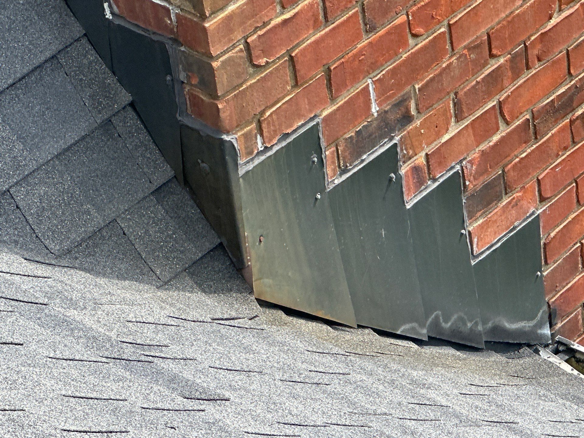 Old step flashing along the chimney up close, Xenia, Ohio.