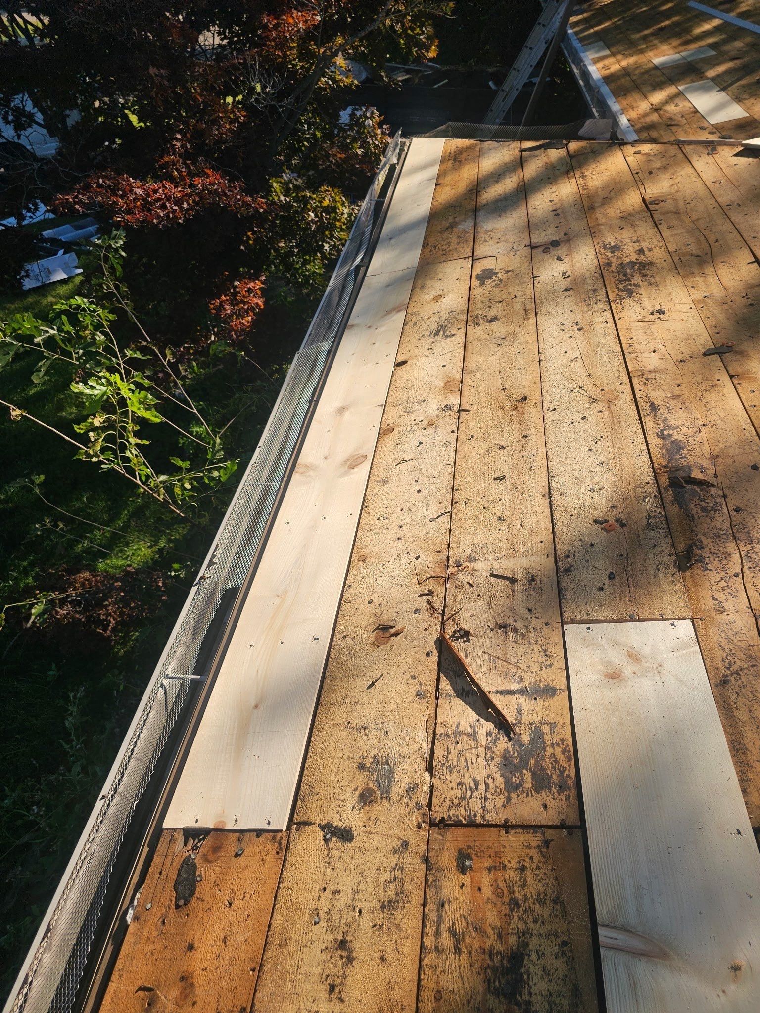 New boards run along the eave in place of rotted planks, Kettering, Ohio.