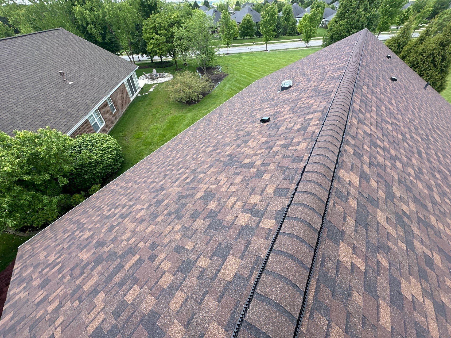 Long run of shingles to the ridge