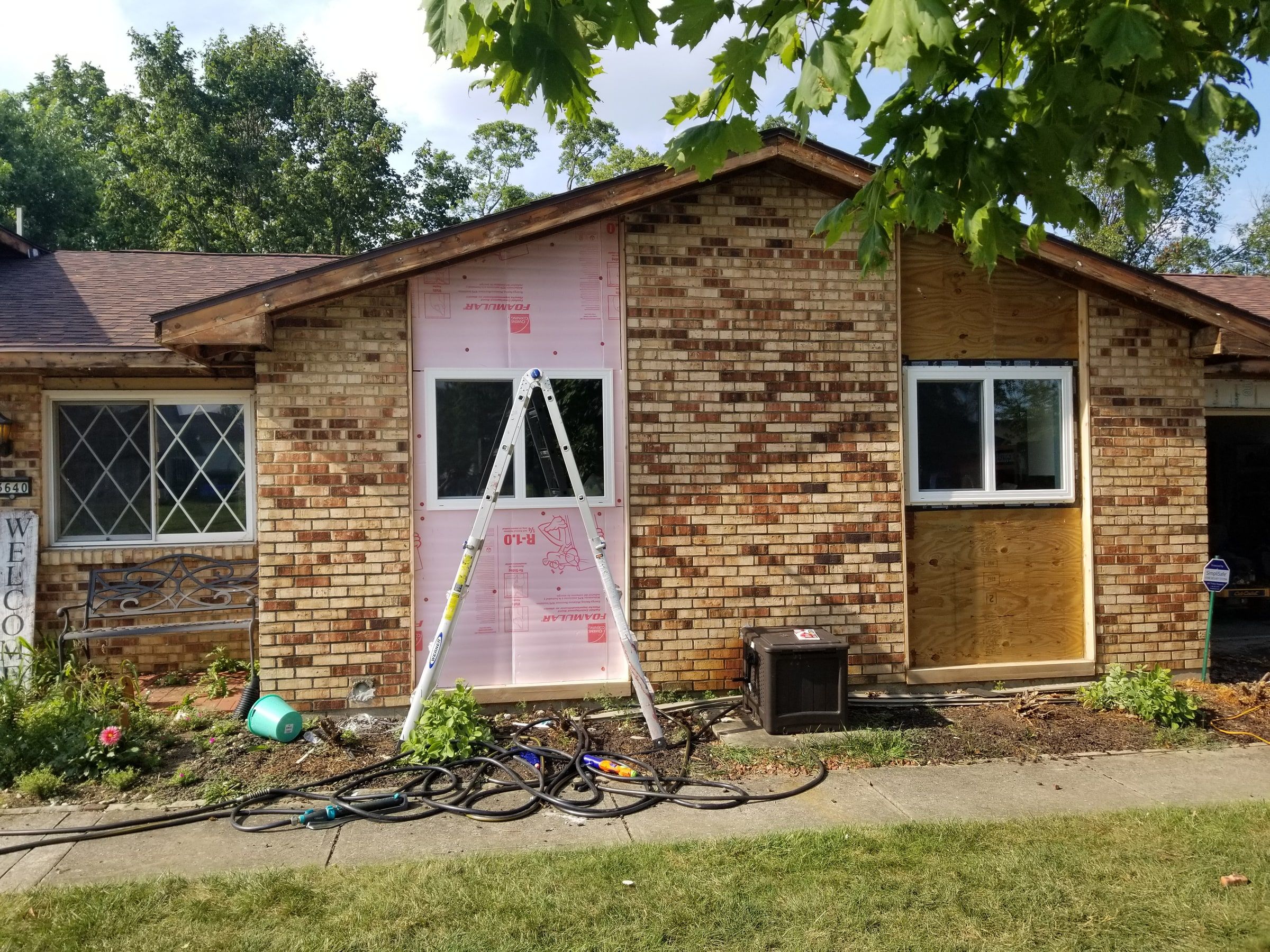 Fanfold board and new plywood on the front of the brick wing, Beavercreek, Ohio.