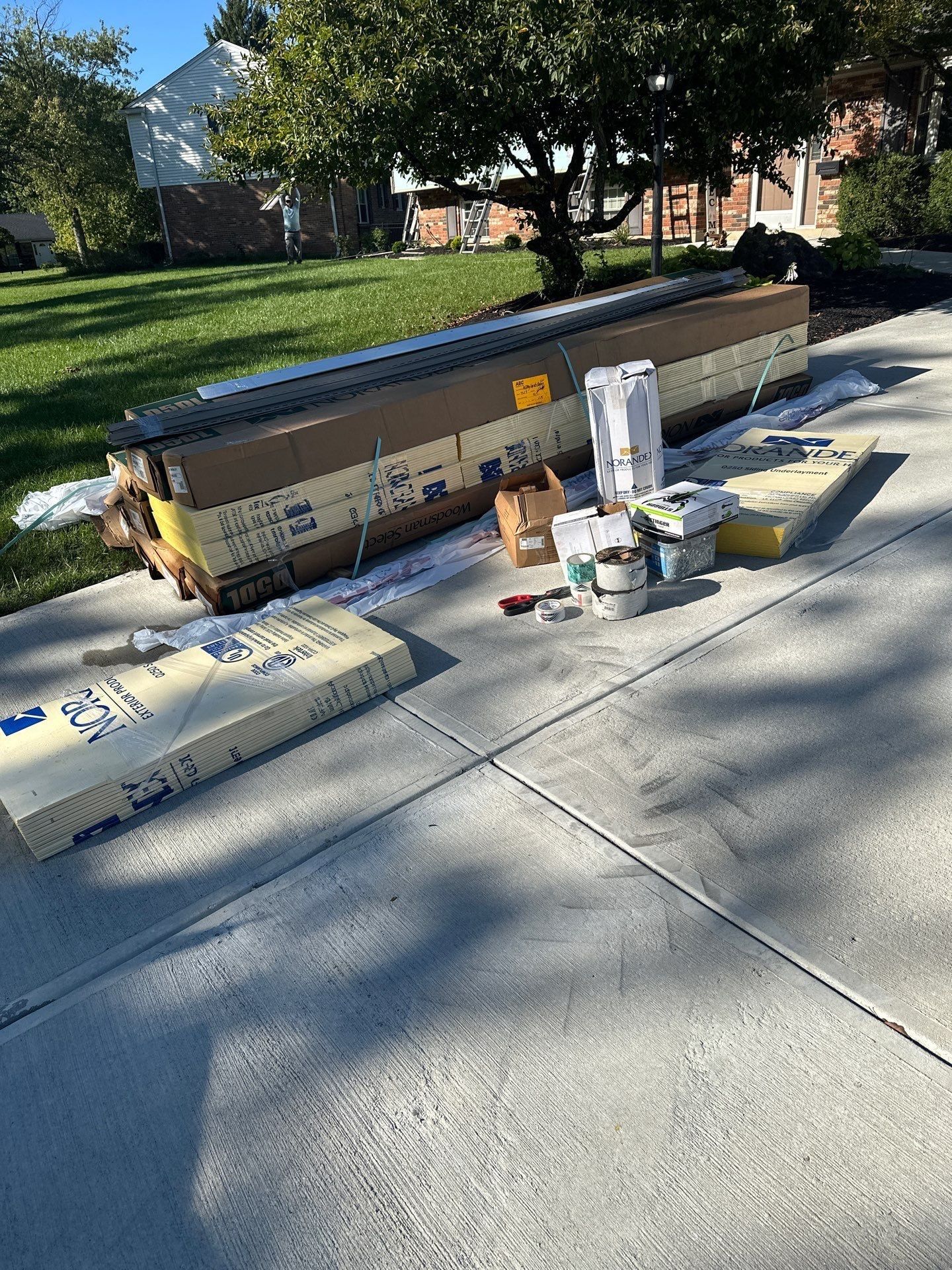 New siding boxes and supplies on the driveway, Beavercreek, Ohio.