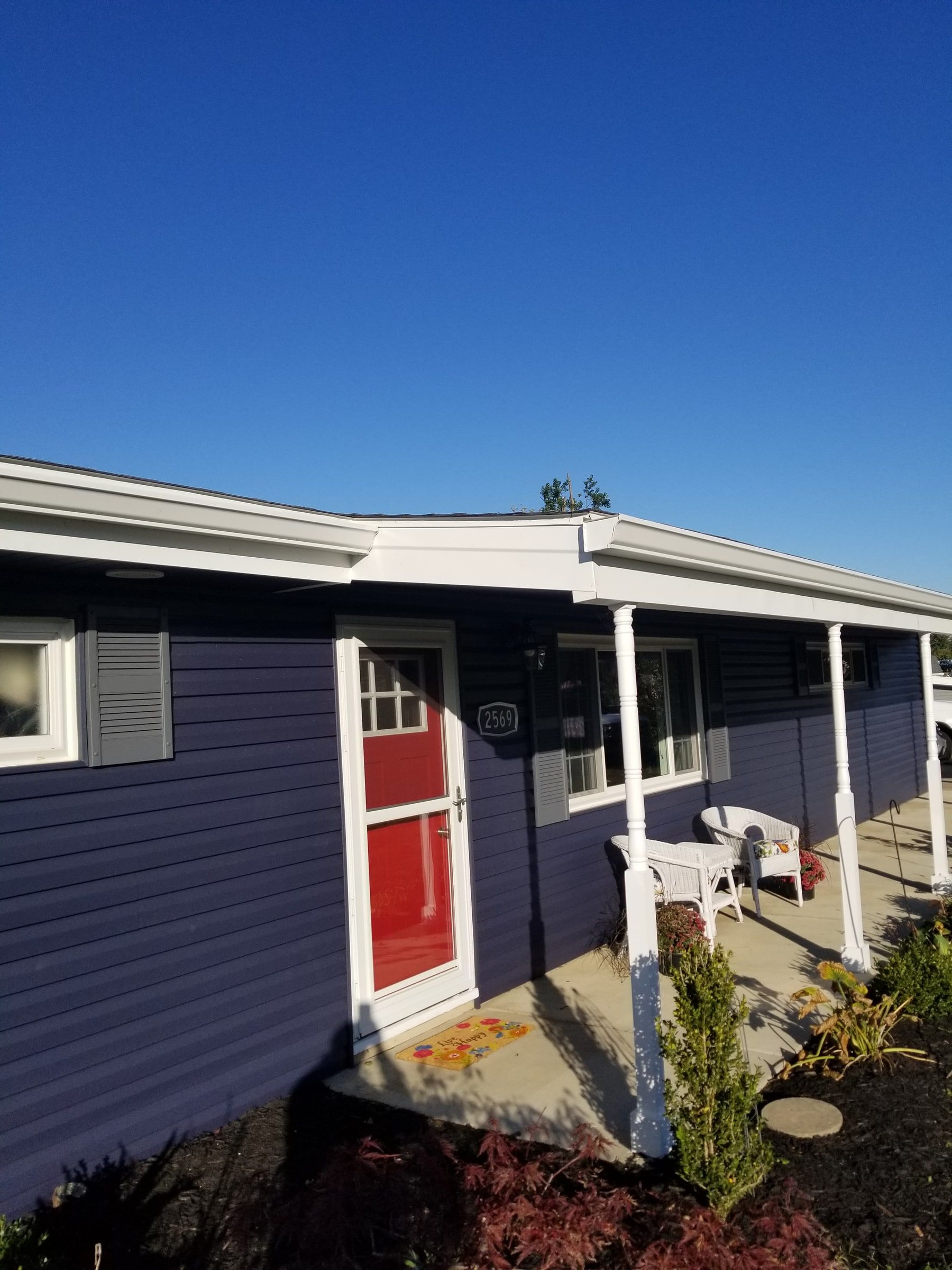 The front porch with its new blue siding and white trim, Beavercreek, Ohio.