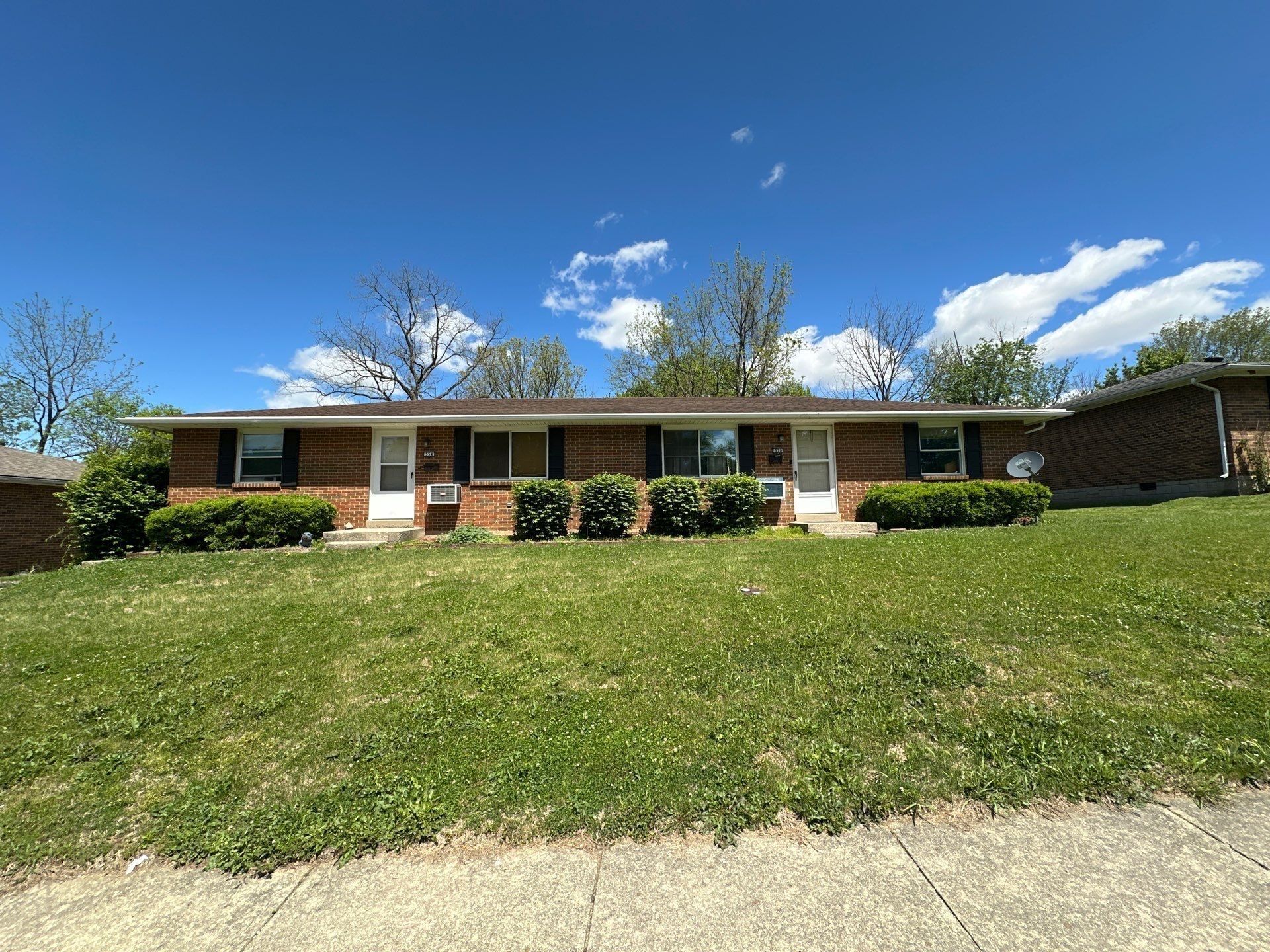 The one-story brick two-unit building from the street, Xenia, Ohio.