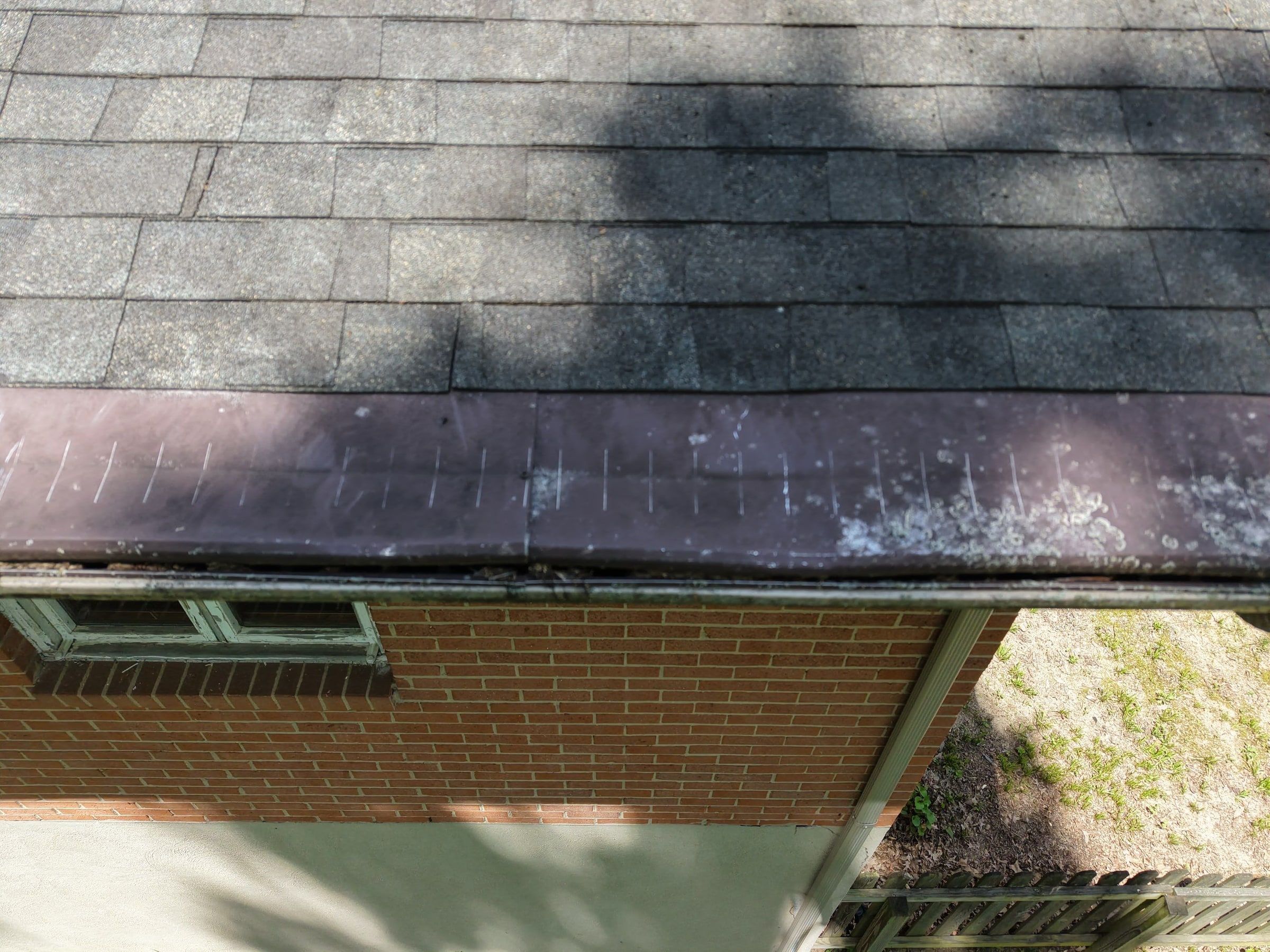 Damage along the roof edge and the old metal edge flashing, Beavercreek, Ohio.