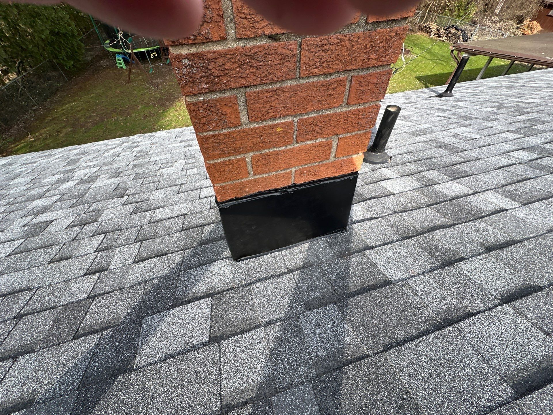 Sealed top edge of the base flashing