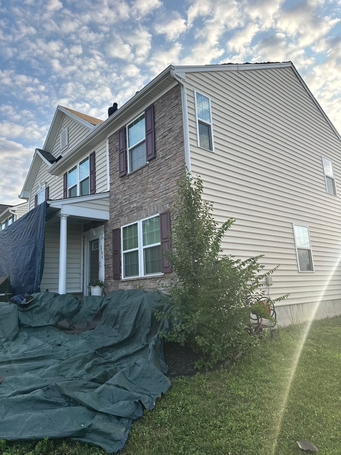Tarps over the front beds and foundation