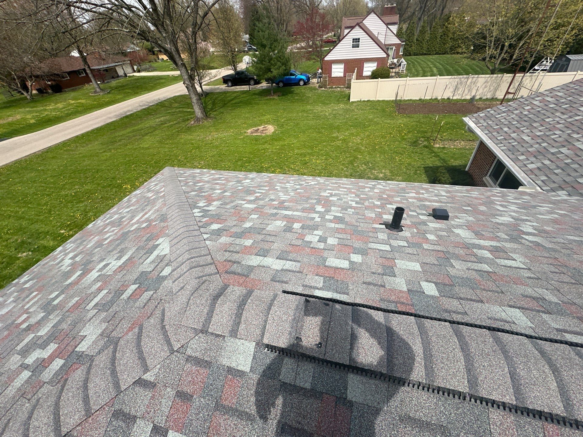 Small exhaust vent caps set into a finished rear slope, Beavercreek, Ohio.