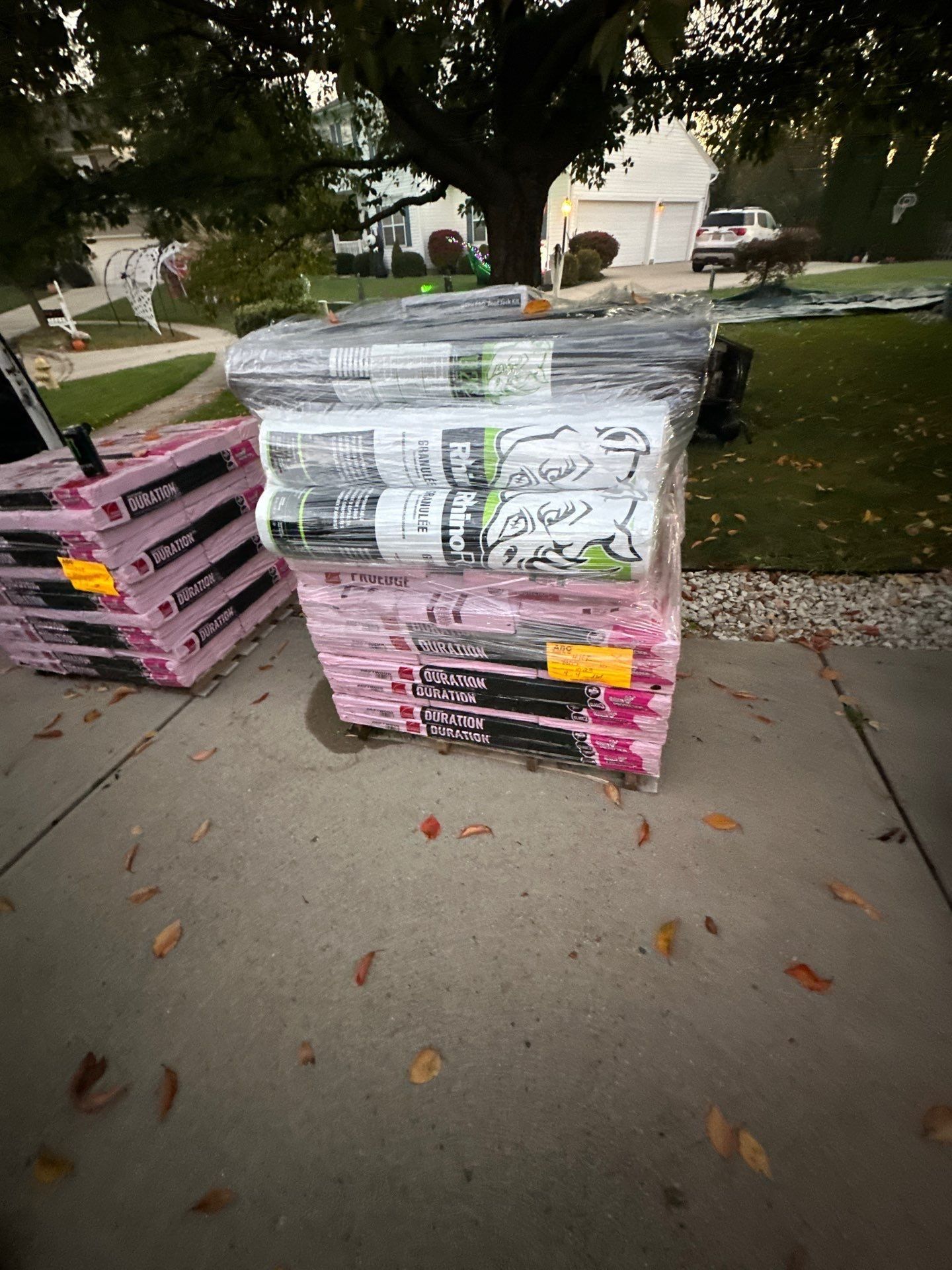 Owens Corning Duration shingles and rolls of synthetic underlayment stacked on the driveway, Beavercreek, Ohio.