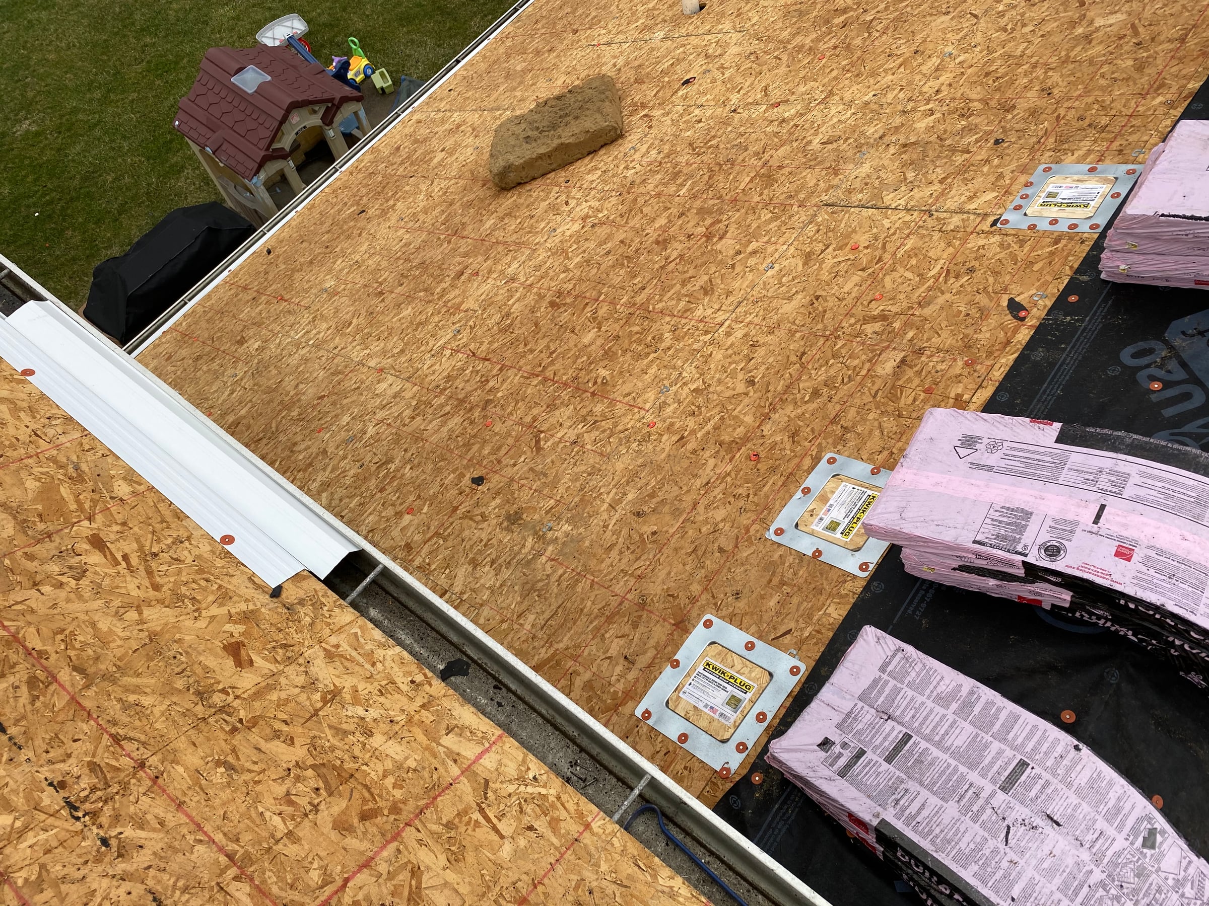 White gutter apron over the bare deck