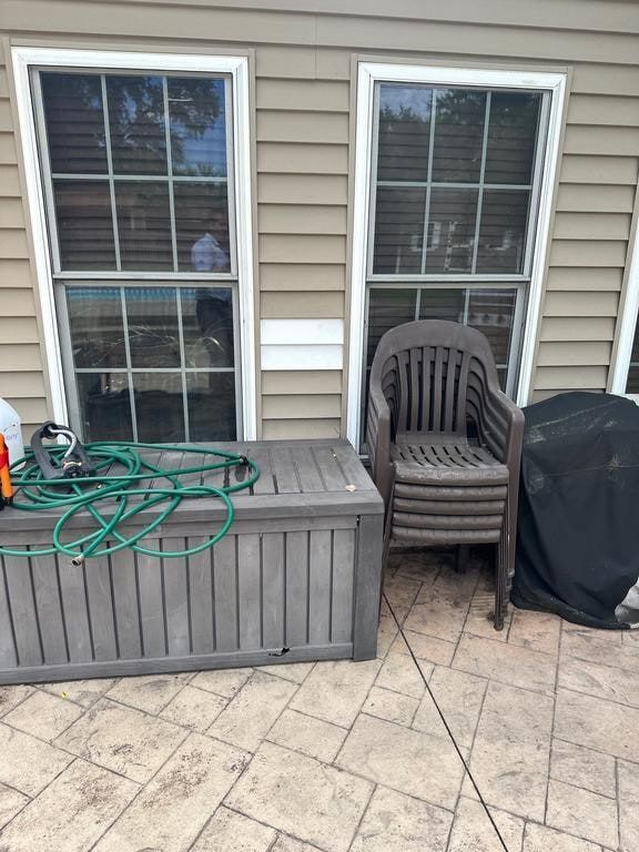 A white patch in the siding beside the patio windows, Beavercreek, Ohio.