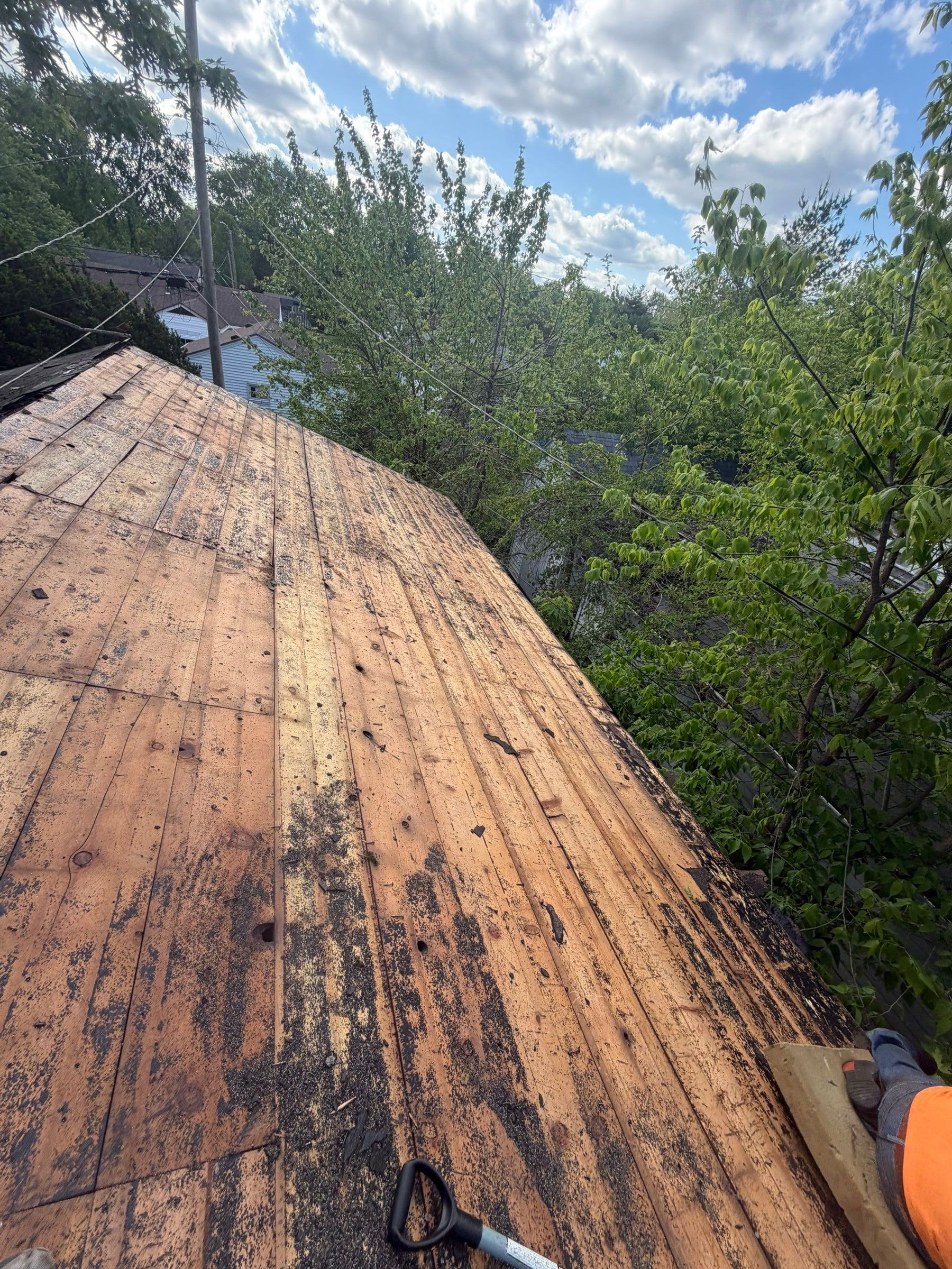 Stripped plane, stained boards and shovel